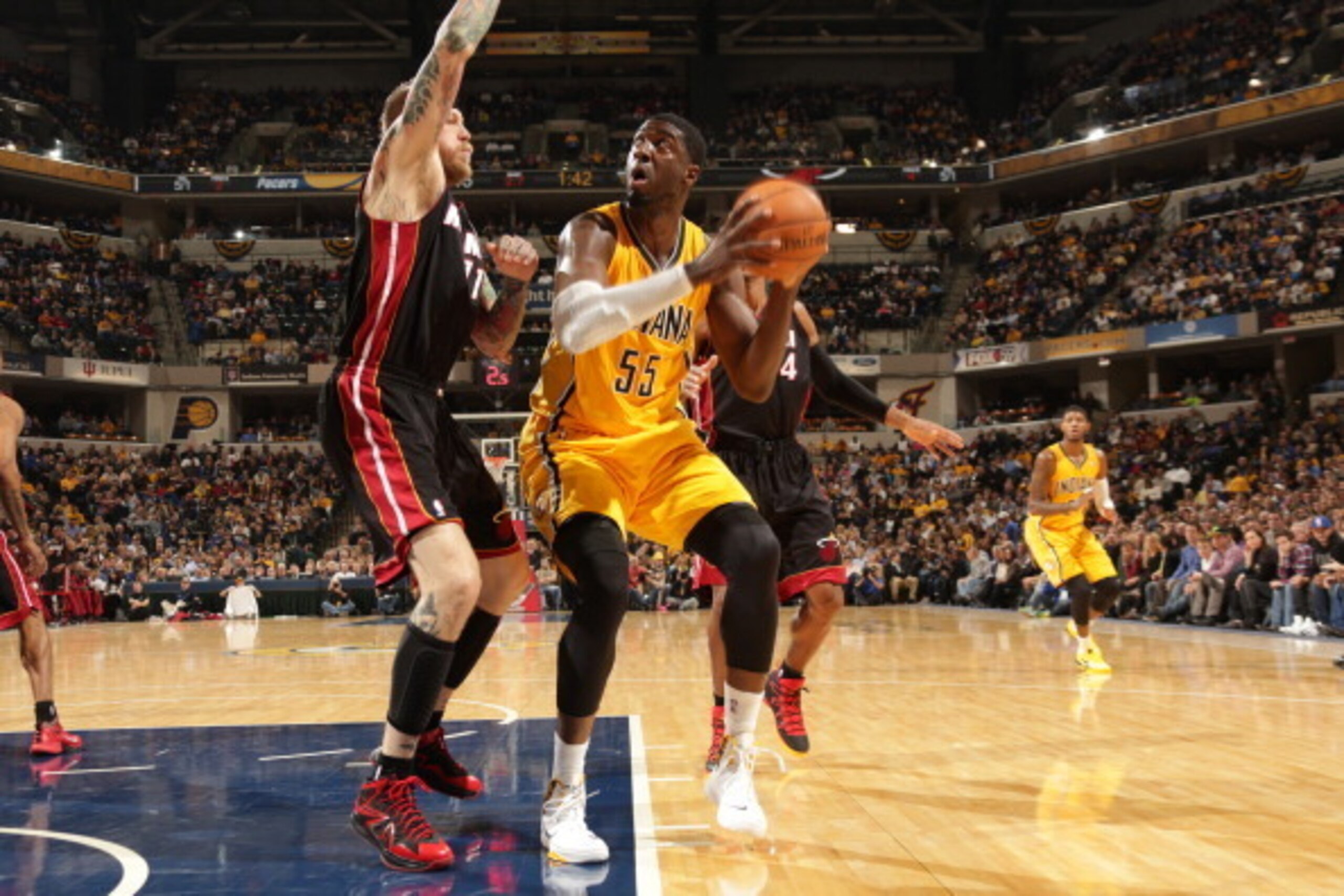 INDIANAPOLIS - DECEMBER 10:  Roy Hibbert #55 of the Indiana Pacers drives to the basket against Chris Andersen #11 of the Miami Heat at Bankers Life Fieldhouse on December 10, 2013 in Indianapolis, Indiana.  NOTE TO USER: User expressly acknowledges and a
