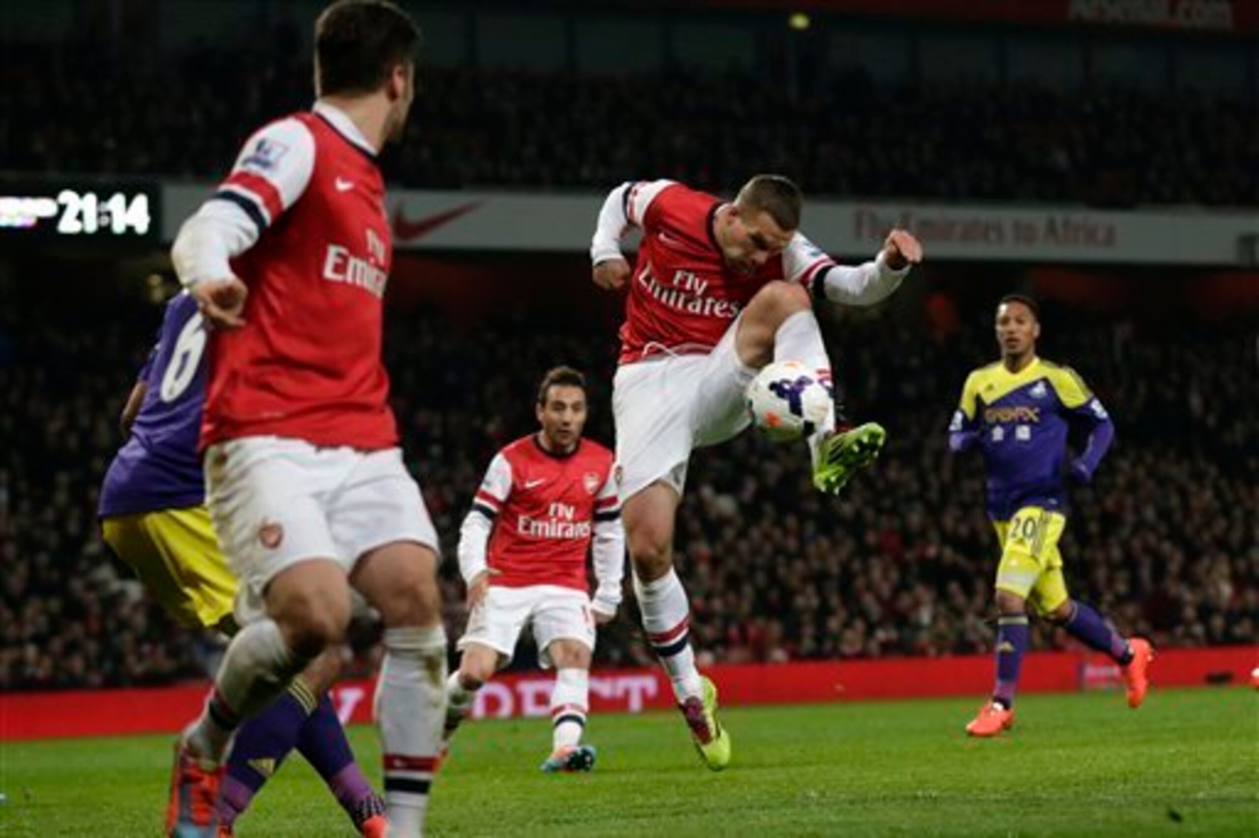 Lukas Podolski, with a goal and assist to his name, was instrumental in the breathtaking period of Arsenal success late in the second half.