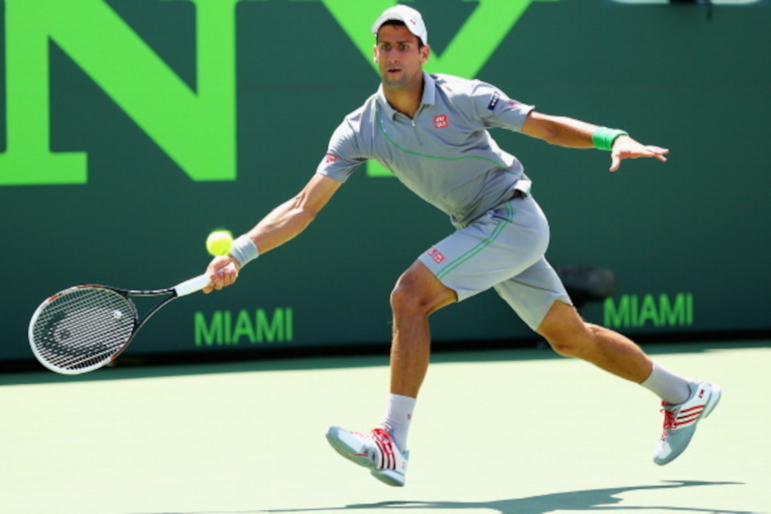 KEY BISCAYNE, FL - MARCH 25:  Novak Djokovic of Serbia returns the ball against Tommie Robredo of Spain during their match on day 9 of the Sony Open at Crandon Park Tennis Center on March 25, 2014 in Key Biscayne, Florida.  (Photo by Al Bello/Getty Images