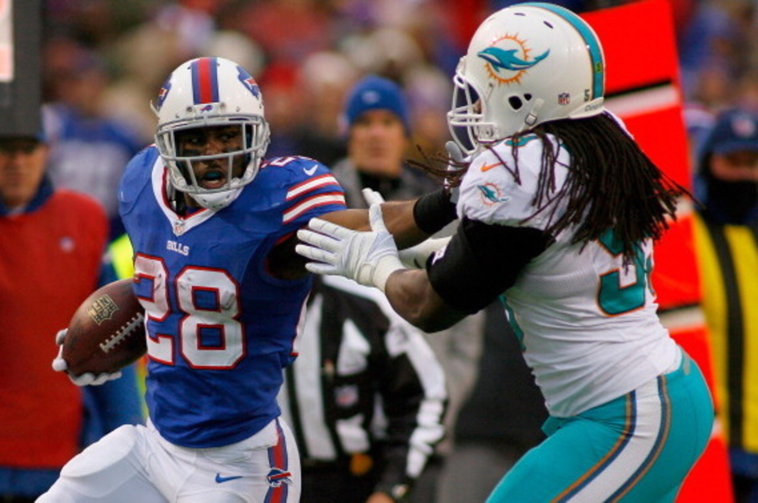 ORCHARD PARK, NY - DECEMBER 22: C.J. Spiller #28 of the Buffalo Bills runsa against Dannell Ellerbe #59 of the Miami Dolphins at Ralph Wilson Stadium on December 22, 2013 in Orchard Park, New York. Buffalo won 16-0. (Photo by Rick Stewart/Getty Images) ORCHARD PARK, NY - DECEMBER 22: C.J. Spiller #28 of the Buffalo Bills runsa against Dannell Ellerbe #59 of the Miami Dolphins at Ralph Wilson Stadium on December 22, 2013 in Orchard Park, New York. Buffalo won 16-0. (Photo by Rick Stewart/Getty Images)