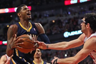 CHICAGO, IL - MARCH 24: Kirk Hinrich #12 of the Chicago Bulls knocks the ball away from Paul George #24 of the Indiana Pacers at the United Center on March 24, 2014 in Chicago, Illinois. The Bulls defeated the Pacers 89-77. NOTE TO USER: User expressly ac