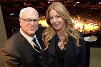 LOS ANGELES, CA - MARCH 25: Phil Jackson and Jeanie Buss pose for a photo before a game between the Los Angeles Lakers and the New York Knicks  at STAPLES Center on March 25, 2014 in Los Angeles, California. NOTE TO USER: User expressly acknowledges and a