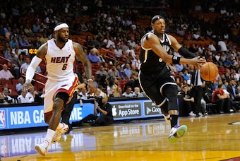 Mar 12, 2014; Miami, FL, USA; Brooklyn Nets forward Paul Pierce (34) lost control of the basketball as Miami Heat forward LeBron James (6) defends during the first half at American Airlines Arena. Mandatory Credit: Steve Mitchell-USA TODAY Sports