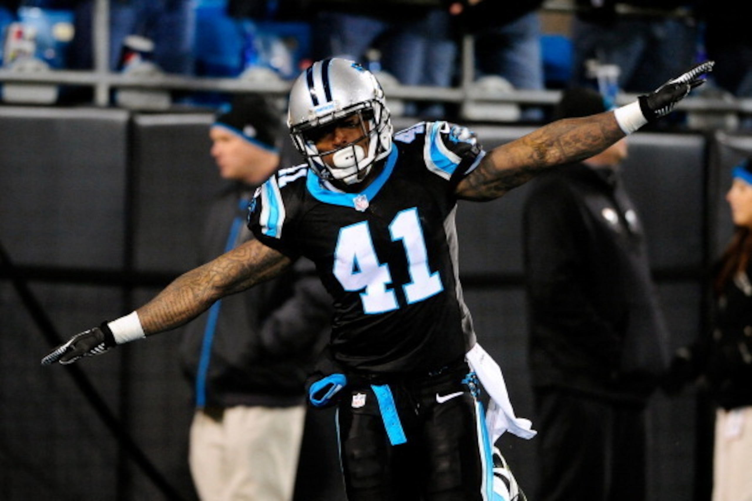 CHARLOTTE, NC - DECEMBER 15:  Captain Munnerlyn #41 of the Carolina Panthers celebrates after returning an interception for a touchdown against the New York Jets during play at Bank of America Stadium on December 15, 2013 in Charlotte, North Carolina. The