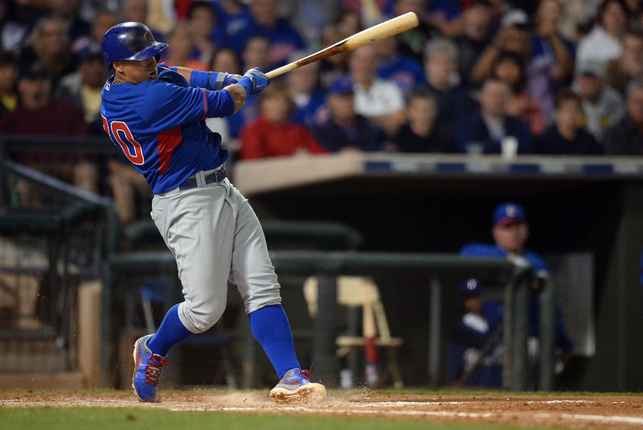 Mar 18, 2014; Surprise, AZ, USA; Chicago Cubs shortstop Javier Baez (70) follows through on a swing against the Texas Rangers at Surprise Stadium. Mandatory Credit: Joe Camporeale-USA TODAY Sports