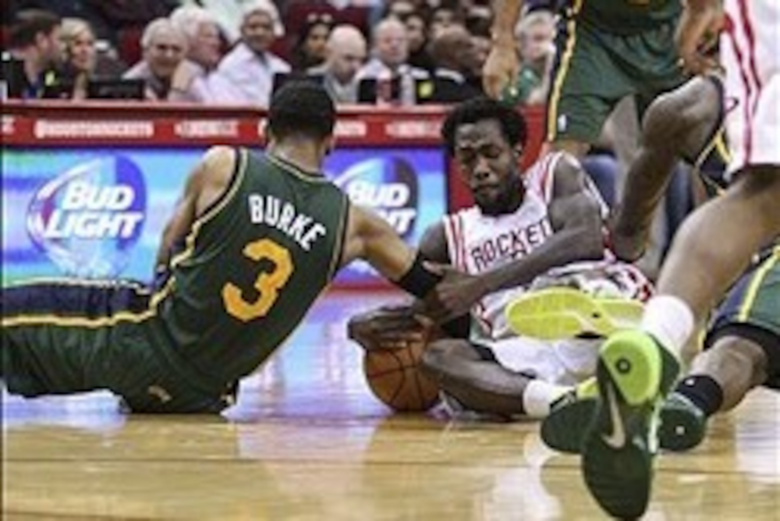 Mar 17, 2014; Houston, TX, USA; Utah Jazz guard Trey Burke (3) and Houston Rockets guard Patrick Beverley (2) battle for the ball during the second quarter at Toyota Center. Mandatory Credit: Troy Taormina-USA TODAY Sports