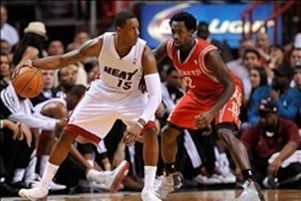 Mar 16, 2014; Miami, FL, USA; Miami Heat guard Mario Chalmers (15) is pressured by Houston Rockets guard Patrick Beverley (2) during the first half at American Airlines Arena. Mandatory Credit: Steve Mitchell-USA TODAY Sports