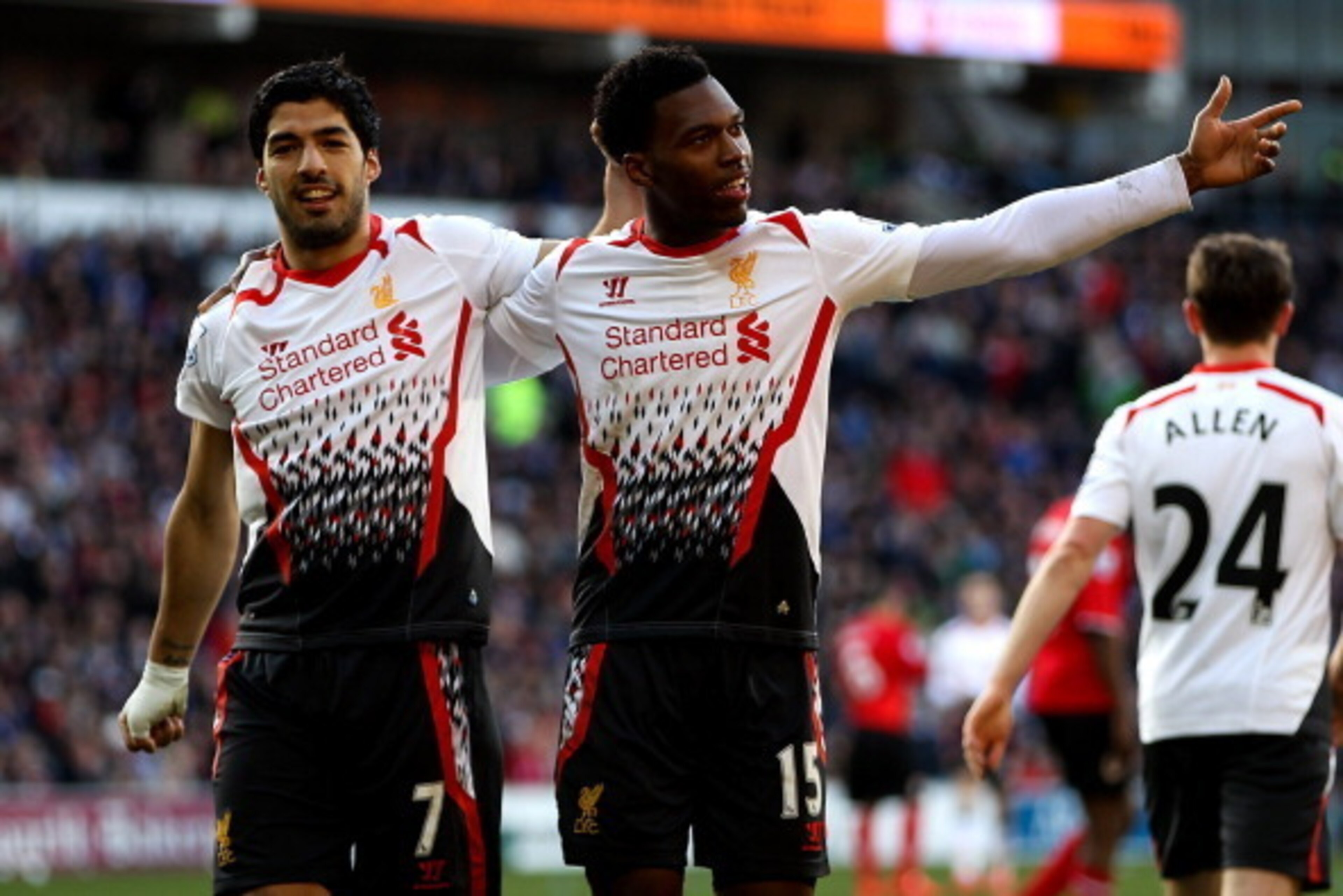 CARDIFF, WALES - MARCH 22:  Daniel Sturridge of Liverpool celebrates with team mate Luis Suarez after scoring his team's fifth goal during the Barclays Premier League match between Cardiff City and Liverpool at Cardiff City Stadium on March 22, 2014 in Ca