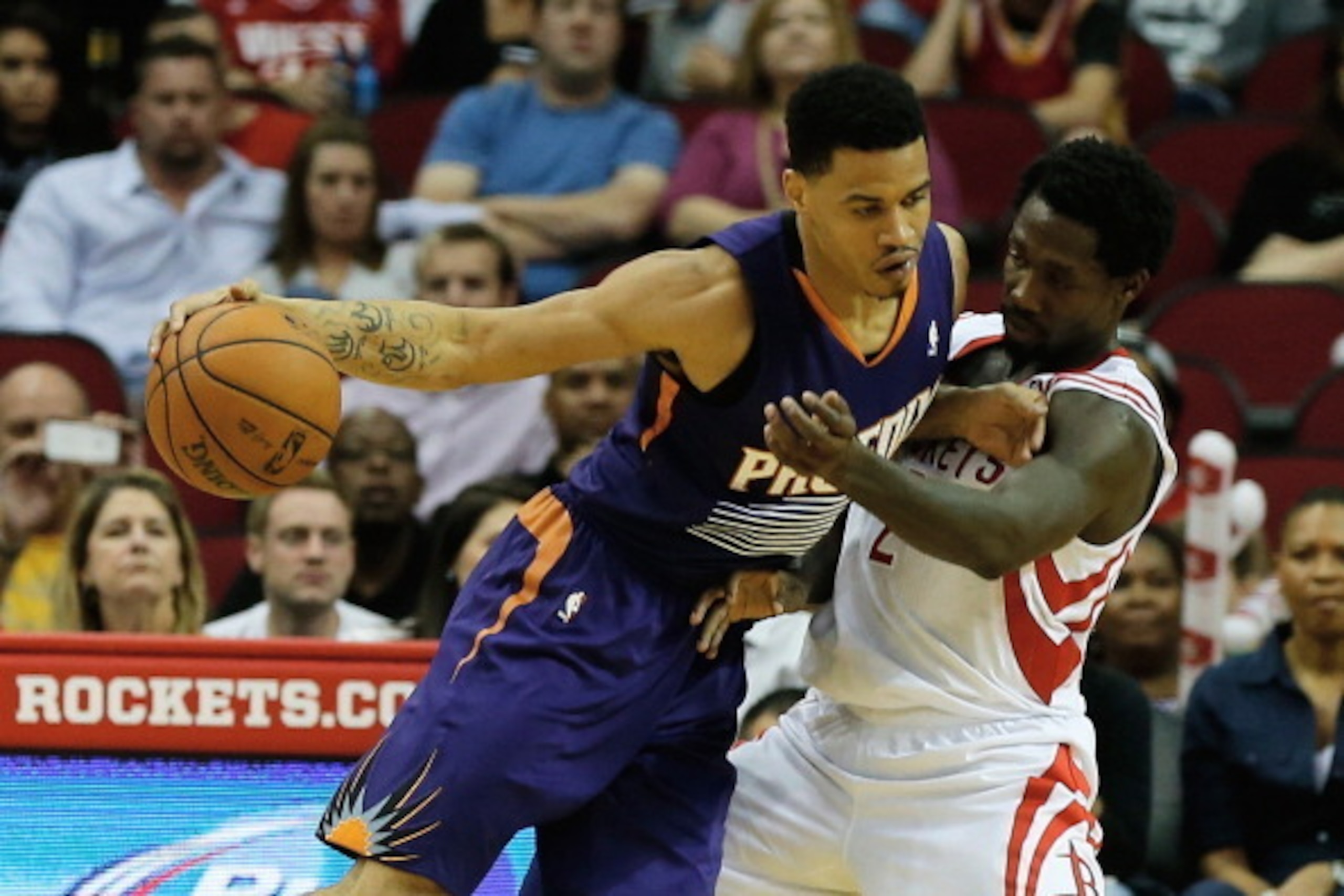 HOUSTON, TX - DECEMBER 04:   Gerald Green #14 of the Phoenix Suns drives against Patrick Beverley #2 of the Houston Rockets during the game at Toyota Center on December 4, 2013 in Houston, Texas. NOTE TO USER: User expressly acknowledges and agrees that, 