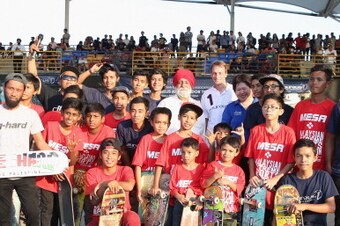 KUALA LUMPUR, MALAYSIA - MARCH 24:  Laureus Academy Member Tony Hawk poses with Su Ling, CEO of YR1M and skatebaorders as he visits an urban skateboard park ahead of the Laureus World Sports Awards at Kiara Skate Park on March 24, 2014 in Kuala Lumpur, Ma