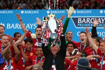 MANCHESTER, ENGLAND - MAY 12:  Manchester United Manager Sir Alex Ferguson lifts the Premier League trophy following the Barclays Premier League match between Manchester United and Swansea City at Old Trafford on May 12, 2013 in Manchester, England.  (Pho