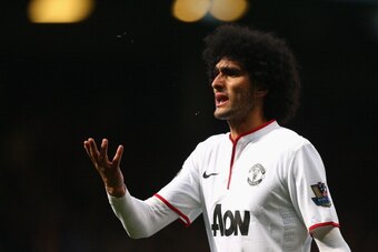 LONDON, ENGLAND - MARCH 22:  Marouane Fellaini of Manchester United looks on during the Barclays Premier League match between West Ham United and Manchester United at Boleyn Ground on March 22, 2014 in London, England.  (Photo by Paul Gilham/Getty Images)