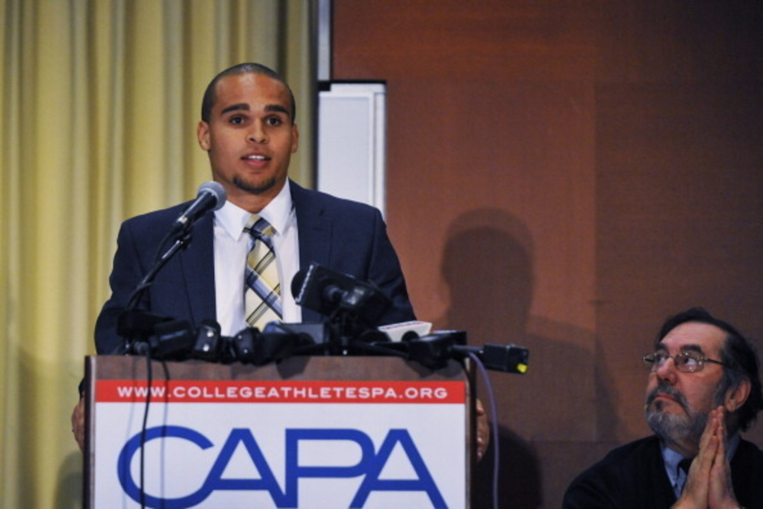 CHICAGO IL - JANUARY 28: Northwestern quarterback Kain Colter speaks at a press conference on January 28 2014 at  The Hyatt Regency Hotel in Chicago Illinois. Citing what they deem as the NCAA's abdication of responsibility to protect athletes from injury