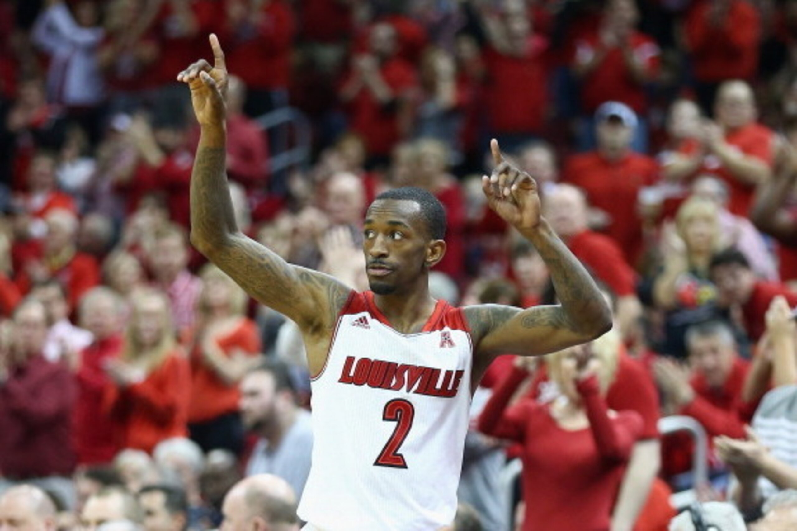 LOUISVILLE, KY - MARCH 08:  Russ Smith #2 of the Louisville Cardinals waves to the crowd after leaving the game for the last time against the Connecticut Huskies at KFC YUM! Center on March 8, 2014 in Louisville, Kentucky.  It was senior day and it was Sm