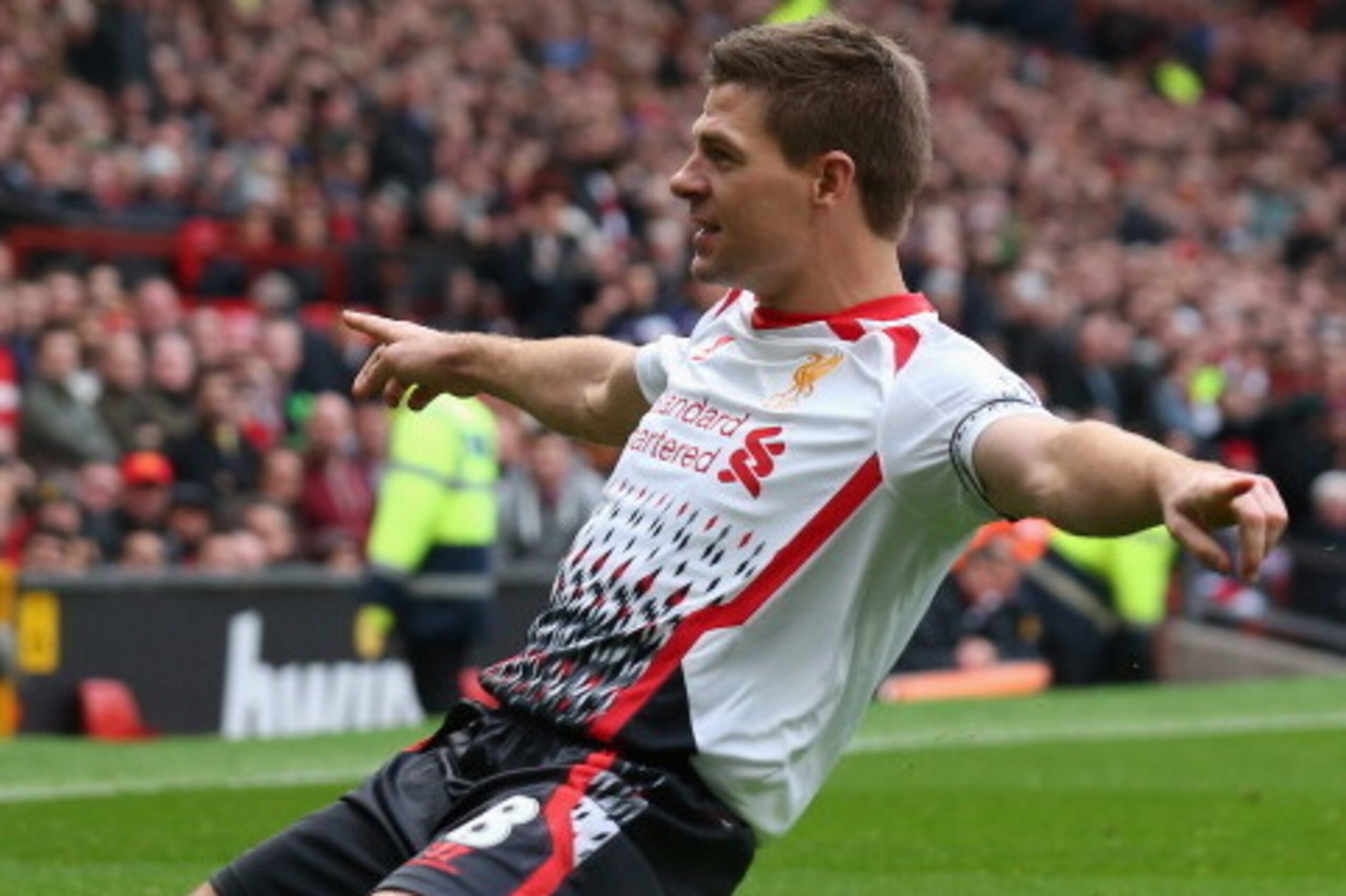 MANCHESTER, ENGLAND - MARCH 16:  Steven Gerrard of Liverpool celebrates scoring the second goal during the Barclays Premier League match between Manchester United and Liverpool at Old Trafford on March 16, 2014 in Manchester, England.  (Photo by Alex Live