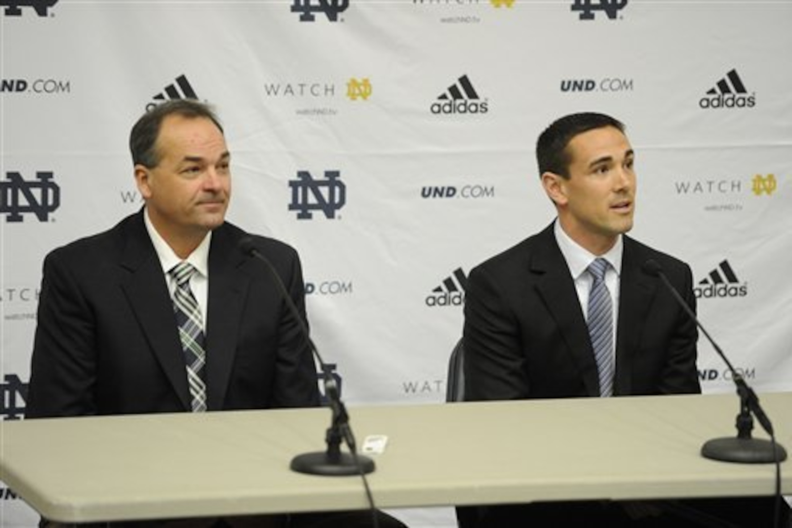 Mike Denbrock and Matt LaFleur meet with the media.