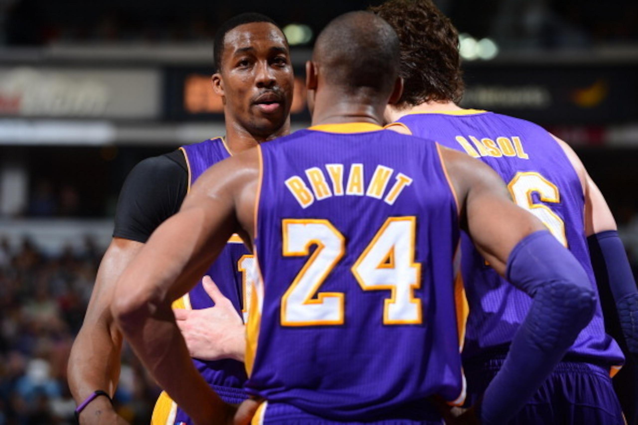 SACRAMENTO, CA - MARCH 30:  Kobe Bryant #24 and Paul Gasol #16 talk with Dwight Howard #12 of the Los Angeles Lakers during a break in action against the Sacramento Kings on March 30, 2013 at Sleep Train Arena in Sacramento, California. NOTE TO USER: User