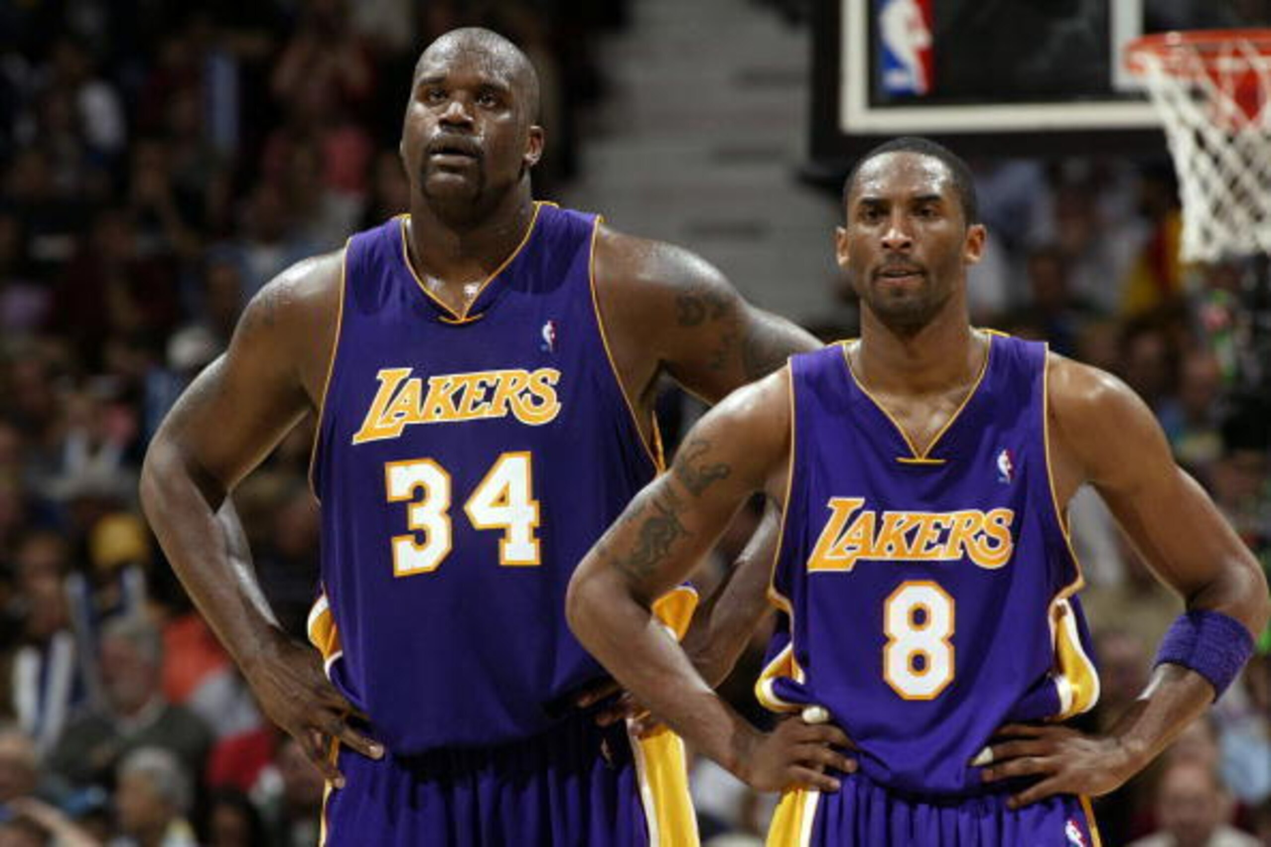 MINNEAPOLIS - MAY 29:  Shaquille O'Neal #34 and Kobe Bryant #8 of the Los Angeles Lakers stand on the court while playing againt the Minnesota Timberwolves in Game Five of the Western Conference Finals during the 2004 NBA Playoffs on May 29, 2004 at Targe