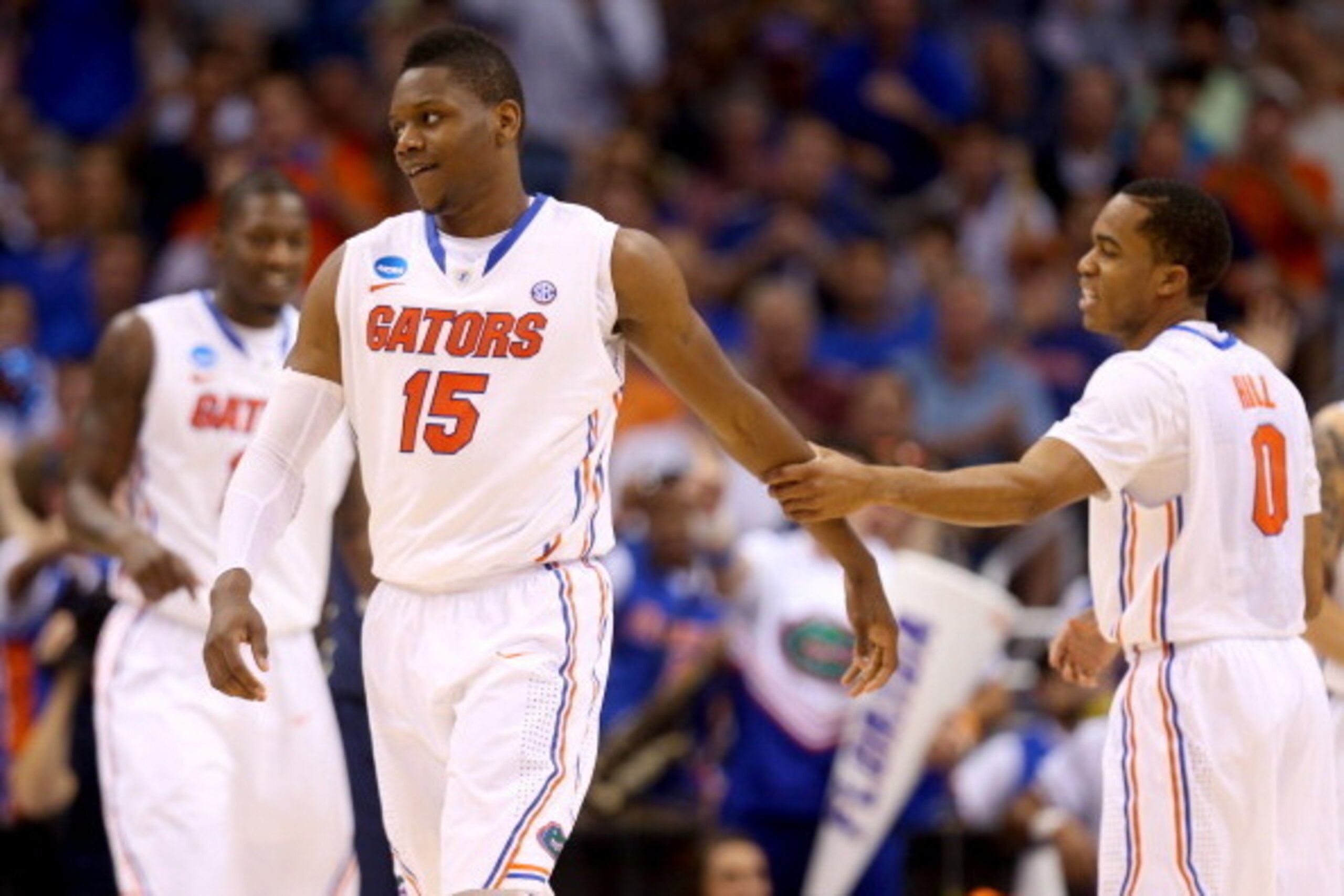 ORLANDO, FL - MARCH 22:  Will Yeguete #15 and Kasey Hill #0 of the Florida Gators react in the second half while taking on the Pittsburgh Panthers during the third round of the 2014 NCAA Men's Basketball Tournament at Amway Center on March 22, 2014 in Orl