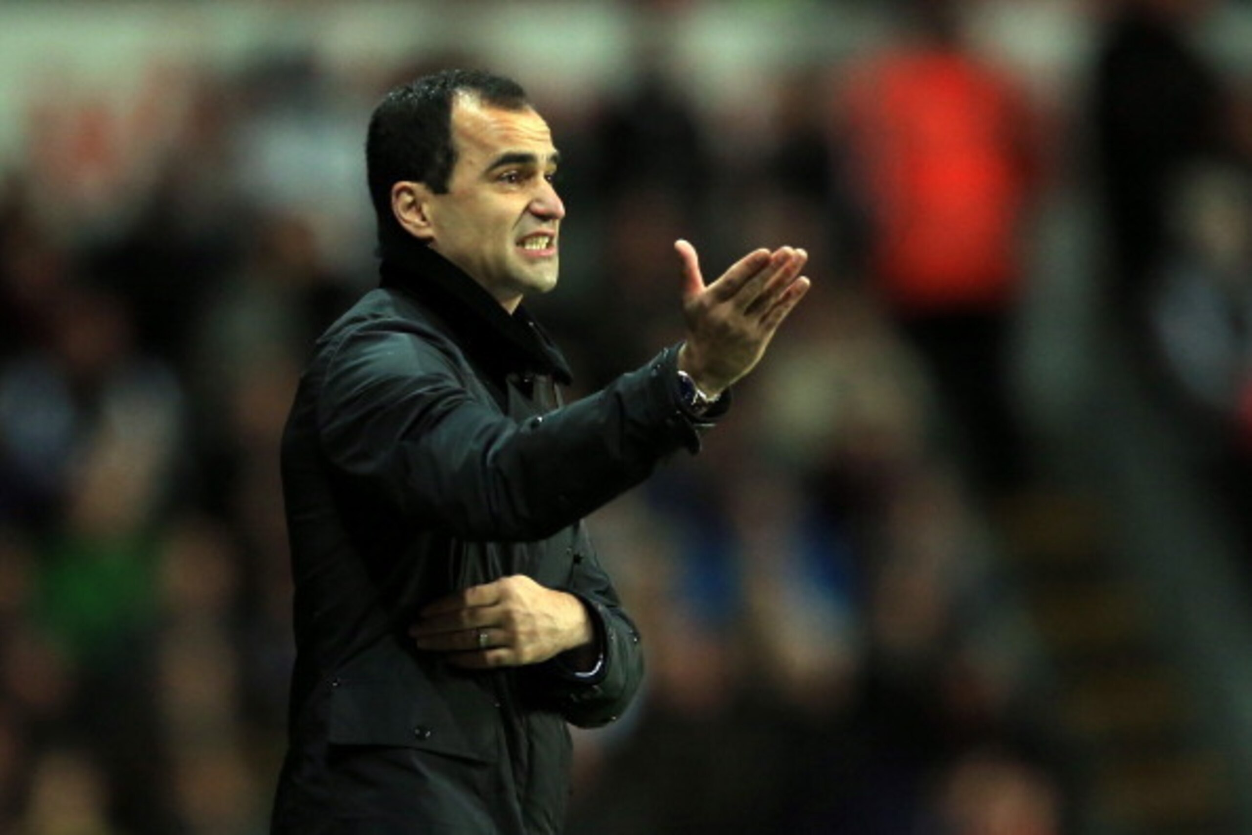 SWANSEA, WALES - DECEMBER 22:  Roberto Martinez the Everton manager reacts during the Barclays Premier League match between Swansea City and Everton at the Liberty Stadium on December 22, 2013 in Swansea, Wales.  (Photo by Richard Heathcote/Getty Images)