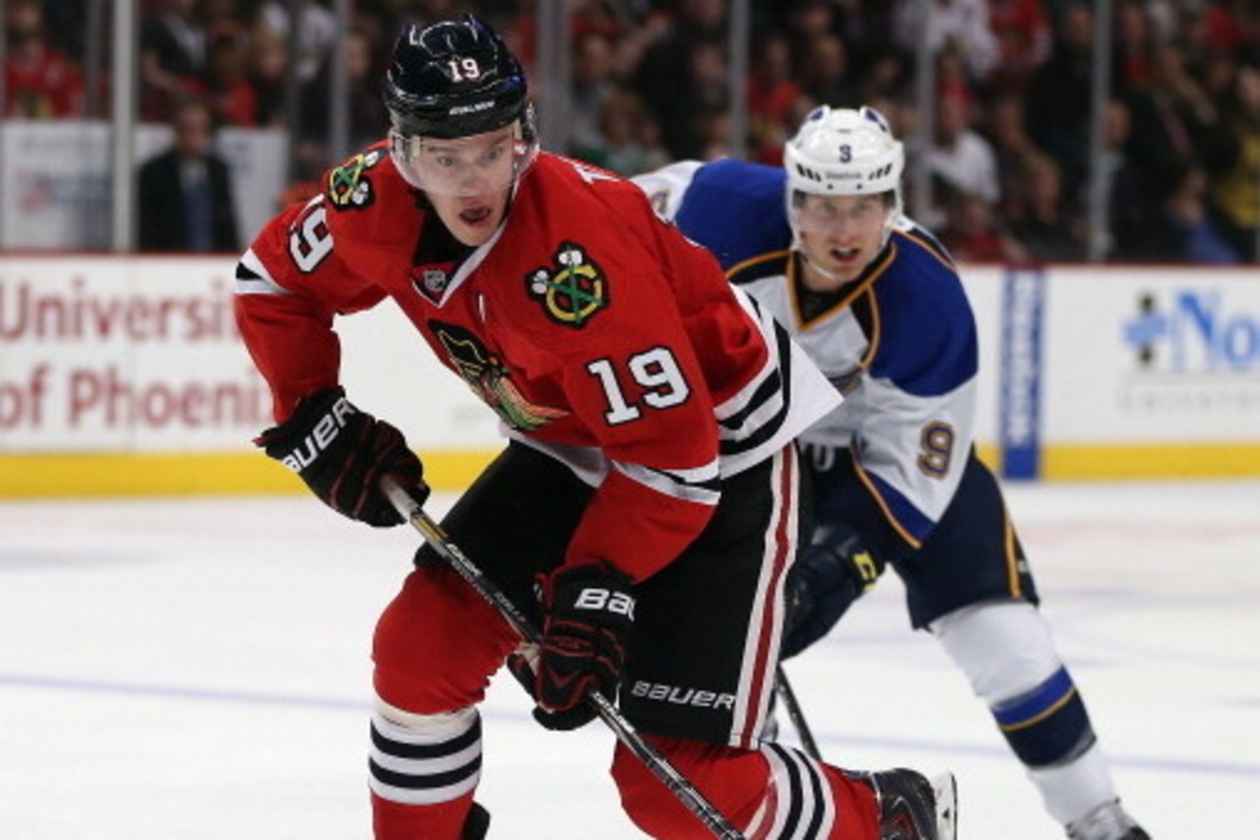 CHICAGO, IL - MARCH 19: Jonathan Toews #19 of the Chicago Blackhawks breaks up the ice in front of Jaden Schwartz #9 of the St. Louis Blues at the United Center on March 19, 2014  in Chicago, Illinois.
(Photo by Jonathan Daniel/Getty Images)