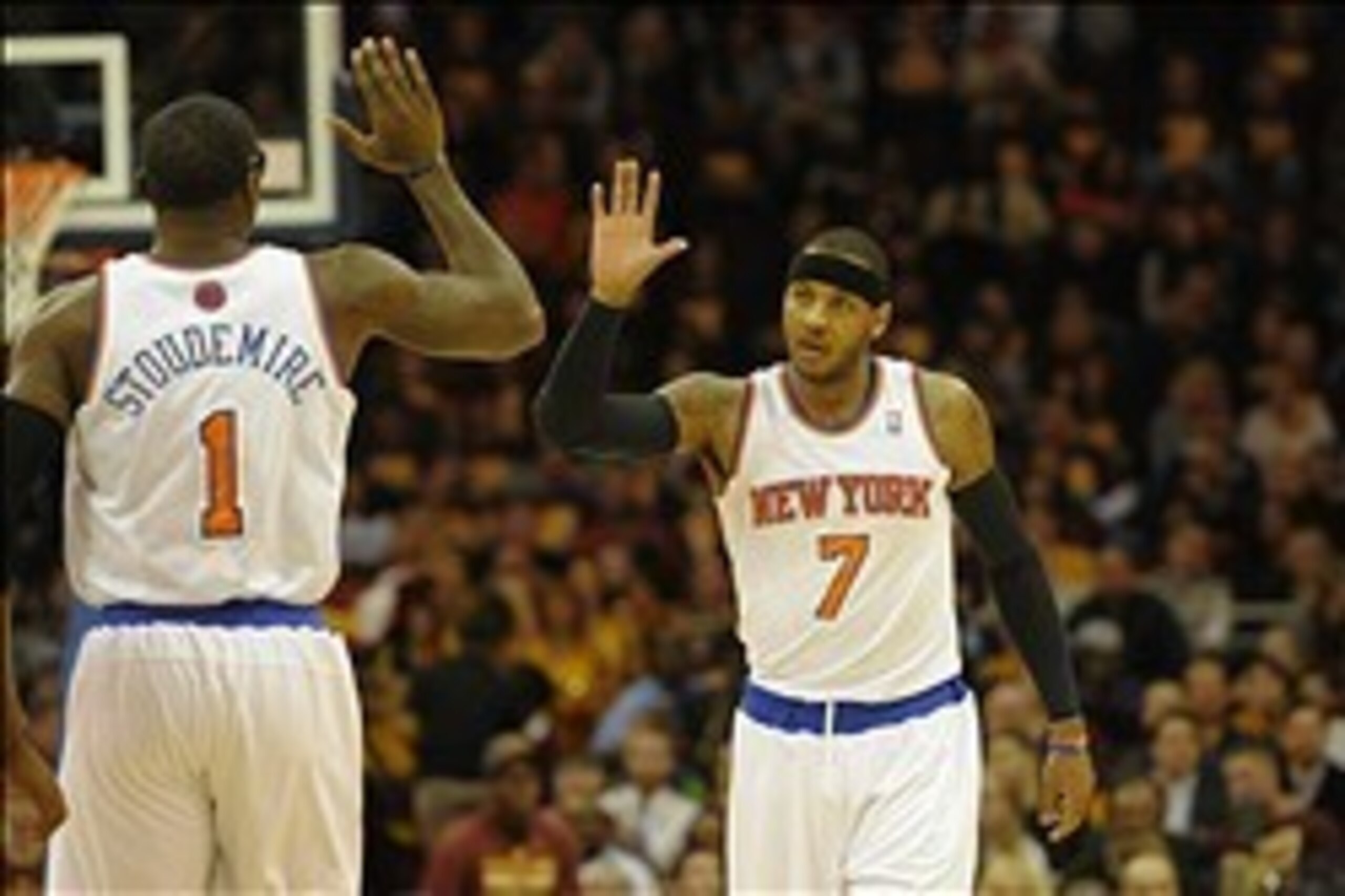 Mar 8, 2014; Cleveland, OH, USA; New York Knicks small forward Carmelo Anthony (7) and power forward Amar'e Stoudemire (1) celebrate in the first quarter at Quicken Loans Arena. Mandatory Credit: David Richard-USA TODAY Sports