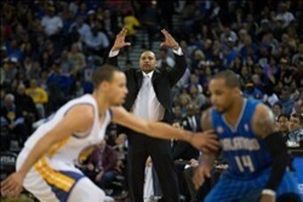 Mar 18, 2014; Oakland, CA, USA; Golden State Warriors head coach Mark Jackson gestures as guard Stephen Curry (30) defends Orlando Magic guard Jameer Nelson (14) during the second quarter at Oracle Arena. Mandatory Credit: Kelley L Cox-USA TODAY Sports