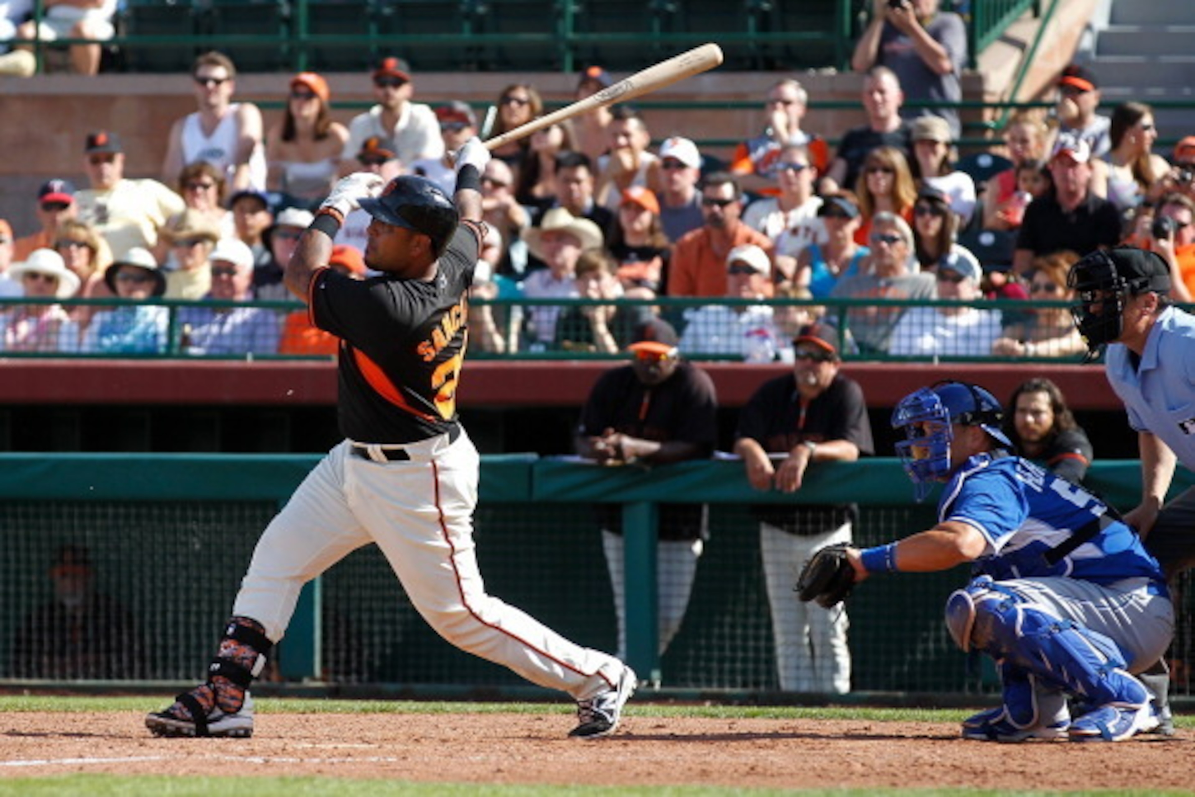 SCOTTSDALE, AZ - MARCH 23: Hector Sanchez #29 of the San Francisco Giants hits a two-run single in the sixth inning during a spring training game against the Kansas City Royals at Scottsdale Stadium on March 23, 2014 in Scottsdale, Arizona. The San Franci