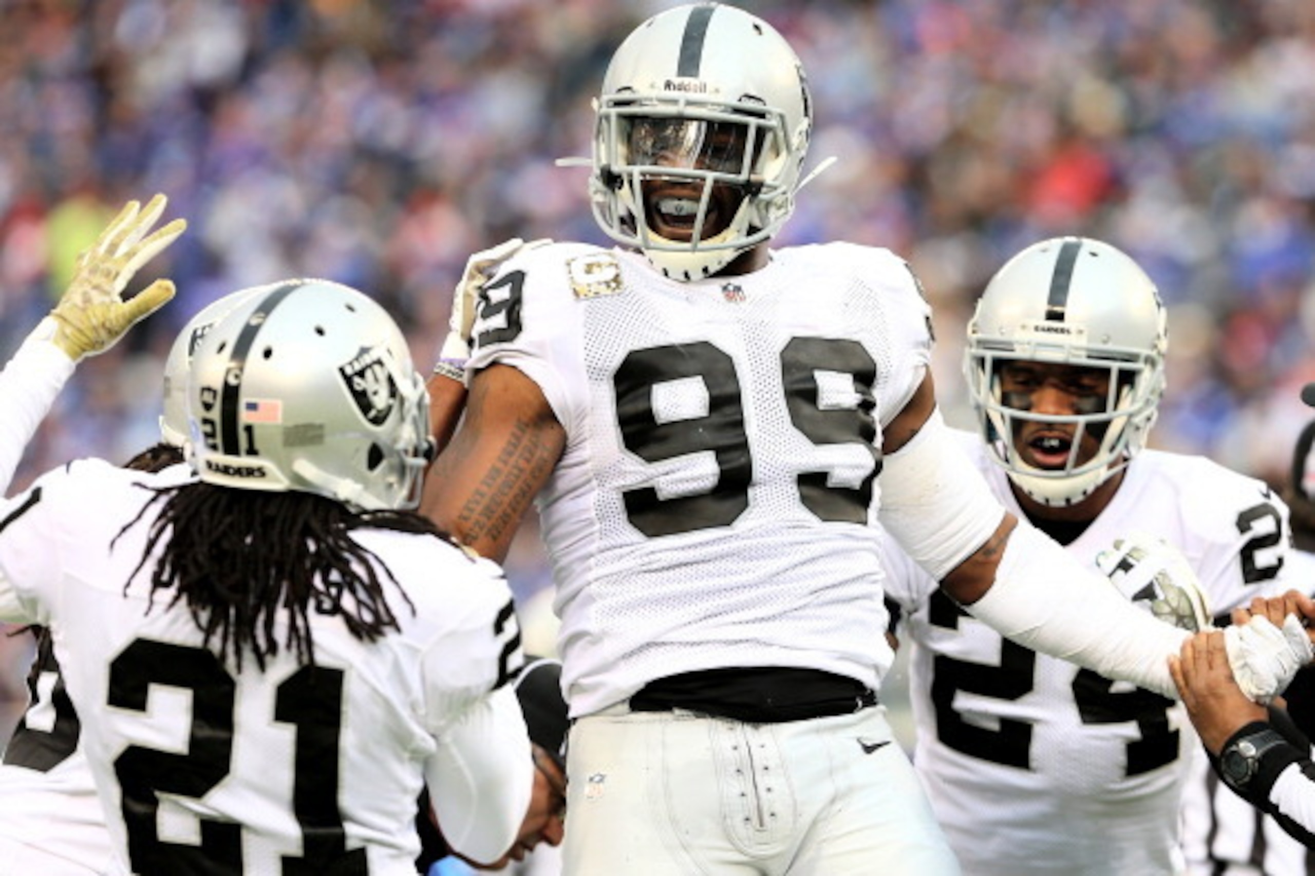 EAST RUTHERFORD, NJ - NOVEMBER 10:  Lamarr Houston #99 of the Oakland Raiders celebrates after he recovers a fumble by  Peyton Hillis of the New York Giants at MetLife Stadium on November 10, 2013 in East Rutherford, New Jersey.  (Photo by Elsa/Getty Imag