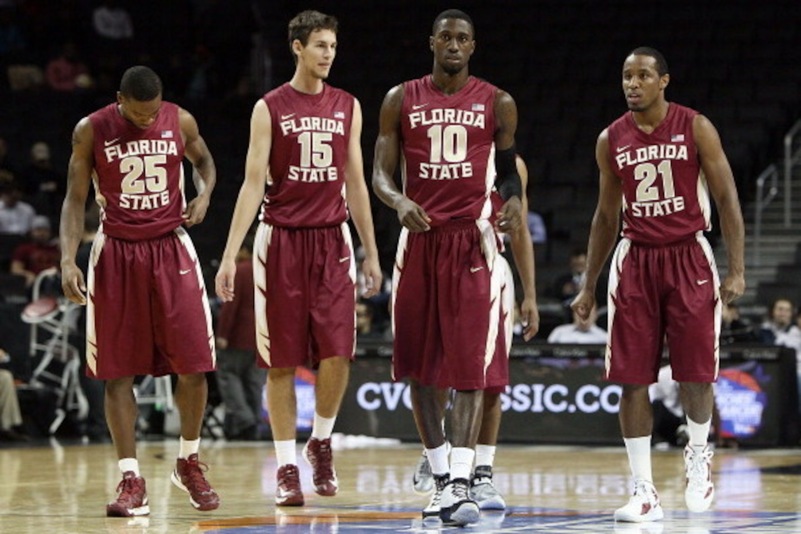 NEW YORK, NY - NOVEMBER 16: Aaron Thomas #25, Boris Bojanovsky #15, Okaro White #10, and Michael Snaer #21 of the Florida State Seminoles walk on the court to play the Brigham Young Cougars during their first round game of the Coaches Vs. Cancer Classic a