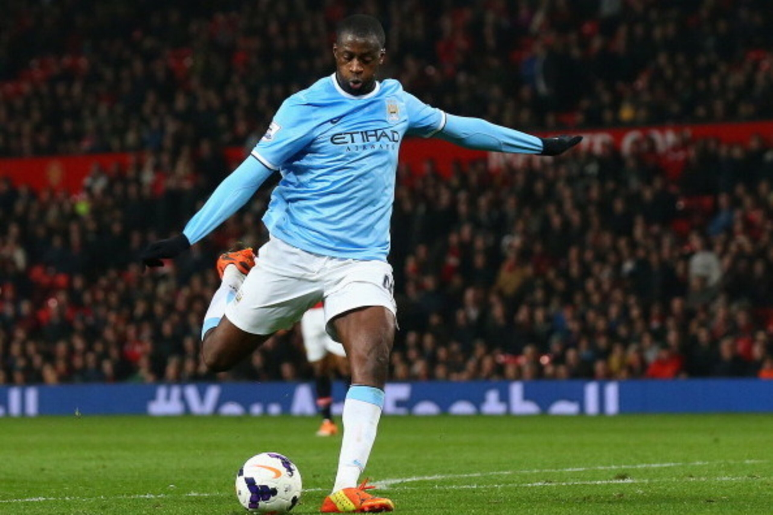 MANCHESTER, ENGLAND - MARCH 25:  Yaya Toure of Manchester City scores the third goal during the Barclays Premier League match between Manchester United and Manchester City at Old Trafford on March 25, 2014 in Manchester, England.  (Photo by Alex Livesey/G