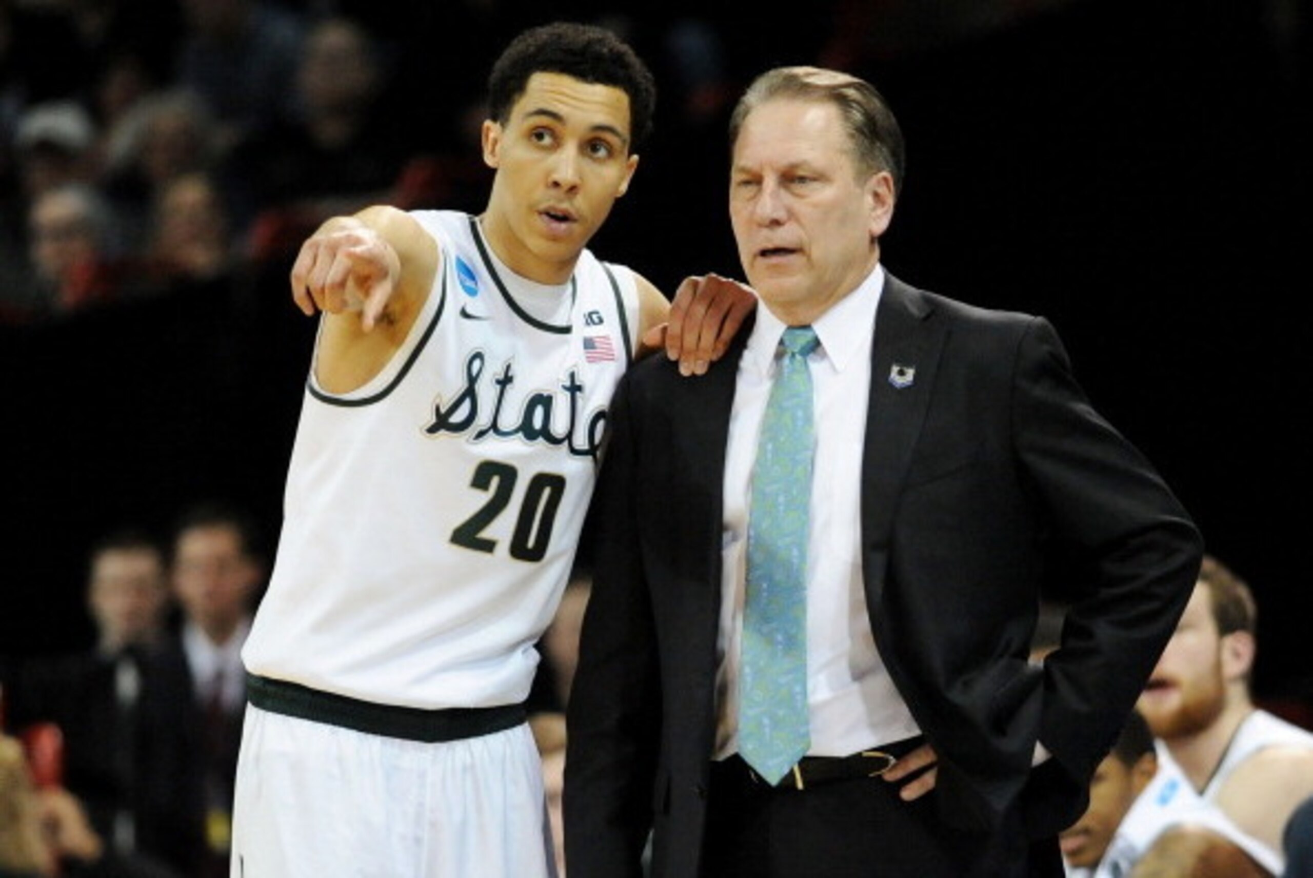 SPOKANE, WA - MARCH 22: Head coach Tom Izzo and Travis Trice #20 of the Michigan State Spartans talk in the second half against the Harvard Crimson during the Third Round of the 2014 NCAA Basketball Tournament at Spokane Veterans Memorial Arena on March SPOKANE, WA - MARCH 22: Head coach Tom Izzo and Travis Trice #20 of the Michigan State Spartans talk in the second half against the Harvard Crimson during the Third Round of the 2014 NCAA Basketball Tournament at Spokane Veterans Memorial Arena on March