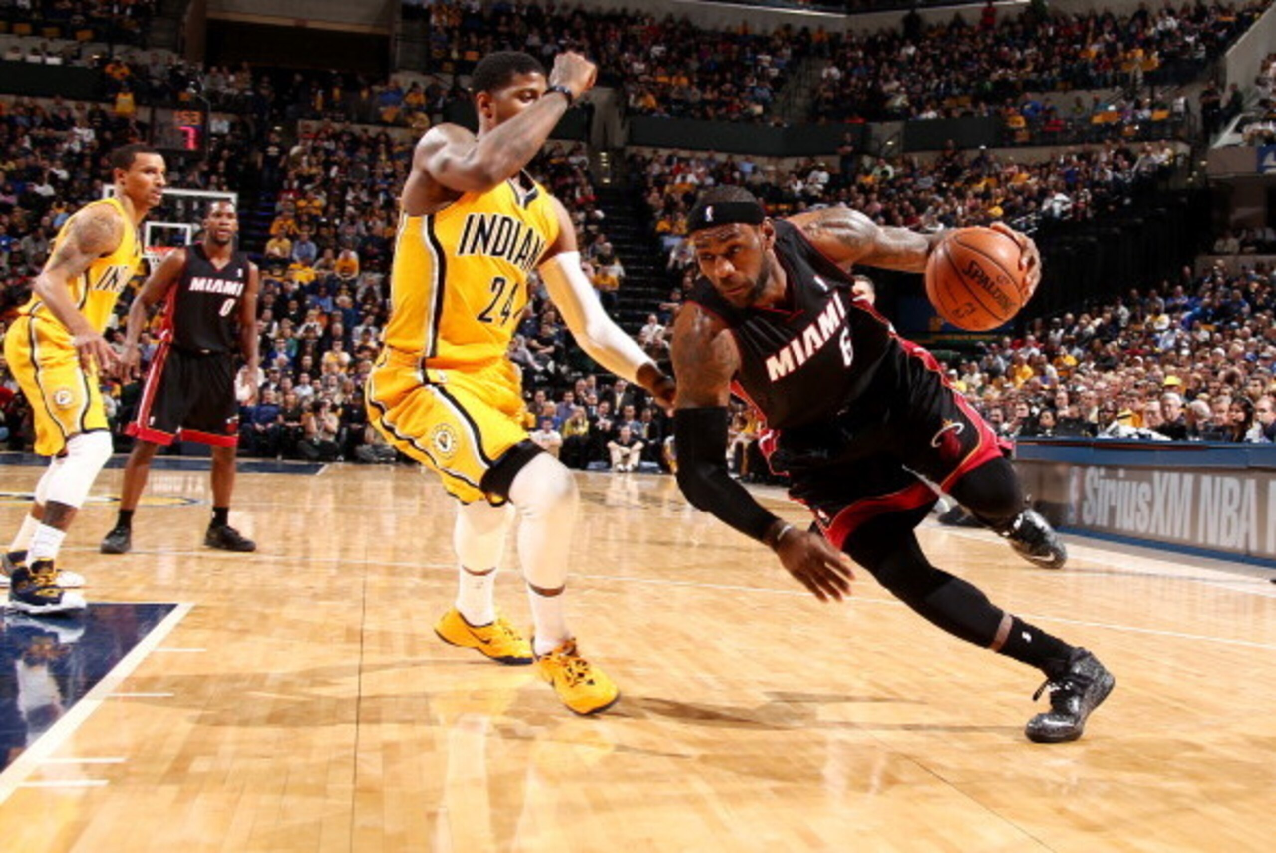 INDIANAPOLIS, IN - MARCH 26: LeBron James #6 of the Miami Heat drives against Paul George #24 of the Indiana Pacers during a game on March 26, 2014 at Bankers Life Fieldhouse in Indianapolis, IN. NOTE TO USER: User expressly acknowledges and agrees that, INDIANAPOLIS, IN - MARCH 26: LeBron James #6 of the Miami Heat drives against Paul George #24 of the Indiana Pacers during a game on March 26, 2014 at Bankers Life Fieldhouse in Indianapolis, IN. NOTE TO USER: User expressly acknowledges and agrees that,