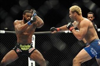 Nov 16, 2013; Las Vegas, NV, USA; Josh Koscheck (red gloves) fights against Tyron Woodley (blue gloves) in their welterweight bout during UFC 167 at MGM Grand Garden Arena. Mandatory Credit: Stephen R. Sylvanie-USA TODAY Sports