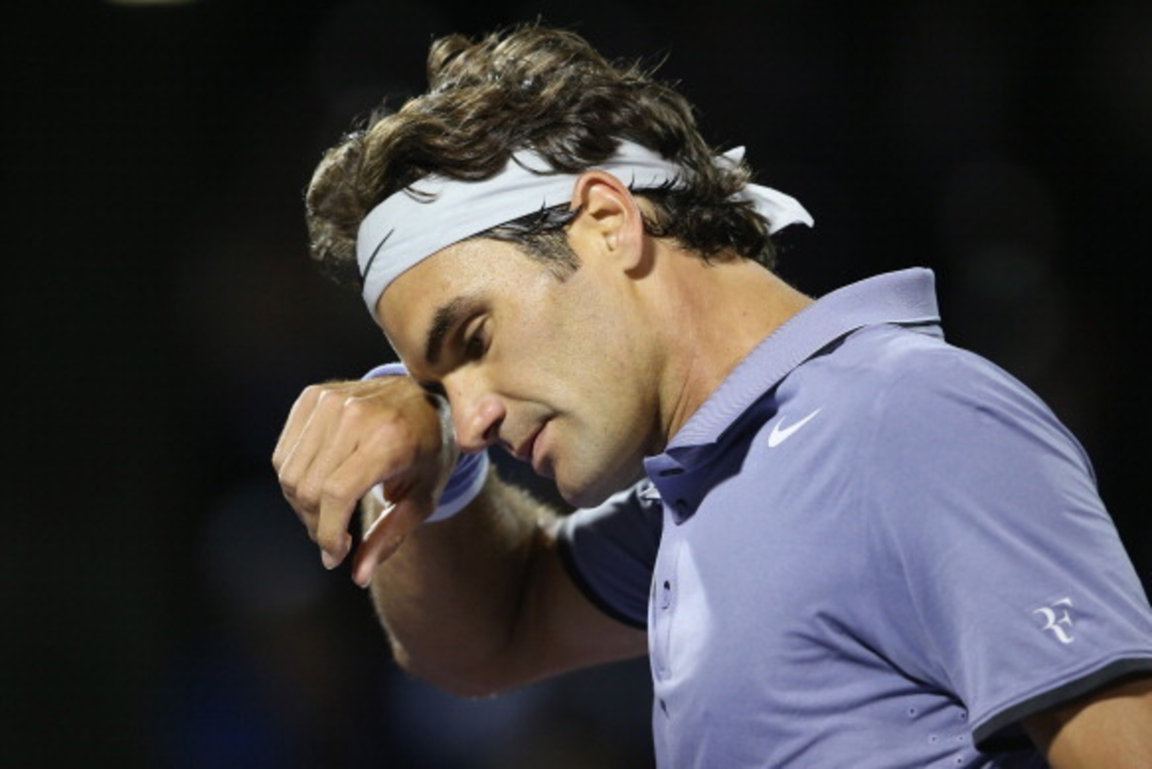 KEY BISCAYNE, FL - MARCH 26:  Roger Federer of Switzerland shows his dejection against Kei Nishikori of Japan during their quarter final round match during day 10 at the Sony Open at Crandon Park Tennis Center on March 26, 2014 in Key Biscayne, Florida.  