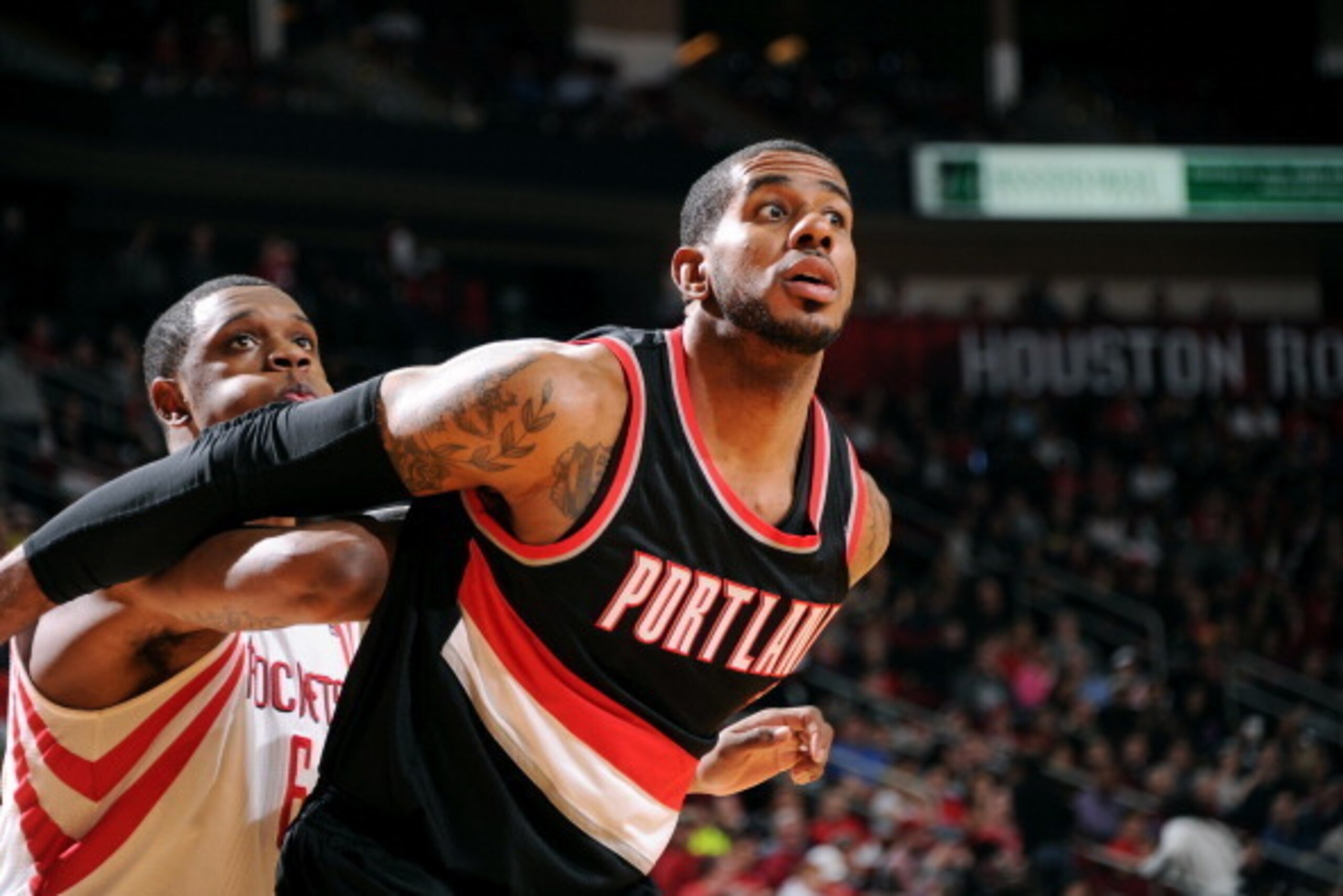 HOUSTON, TX - MARCH 9:  LaMarcus Aldridge #12 of the Portland Trail Blazers battles for position against Terrence Jones #6 of the Houston Rockets on March 9, 2014 at the Toyota Center in Houston, Texas. NOTE TO USER: User expressly acknowledges and agrees