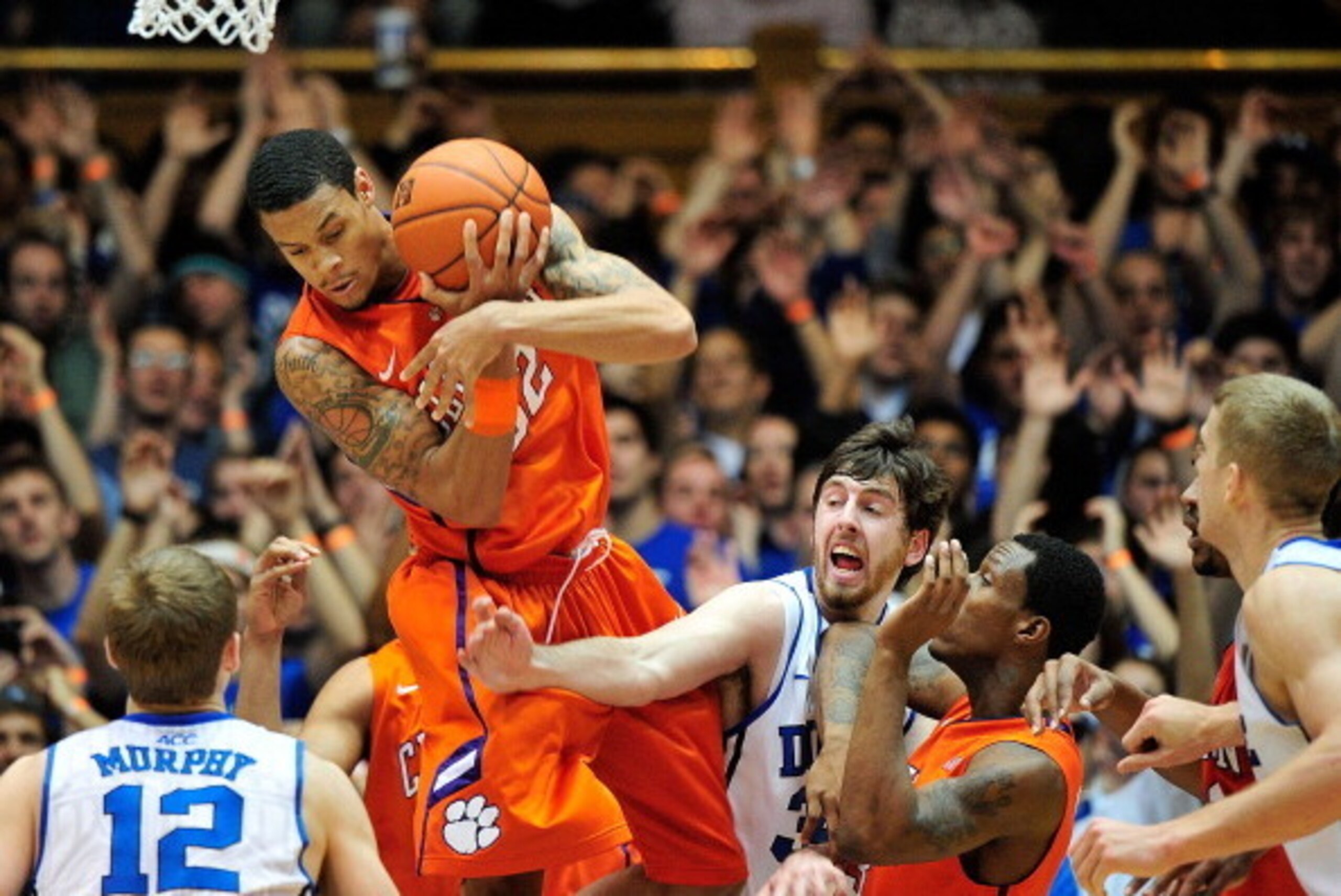 DURHAM, NC - JANUARY 08:  K.J. McDaniels #32 of the Clemson Tigers pulls down a rebound against Ryan Kelly #34 of the Duke Blue Devils during play at Cameron Indoor Stadium on January 8, 2013 in Durham, North Carolina.  (Photo by Grant Halverson/Getty Ima