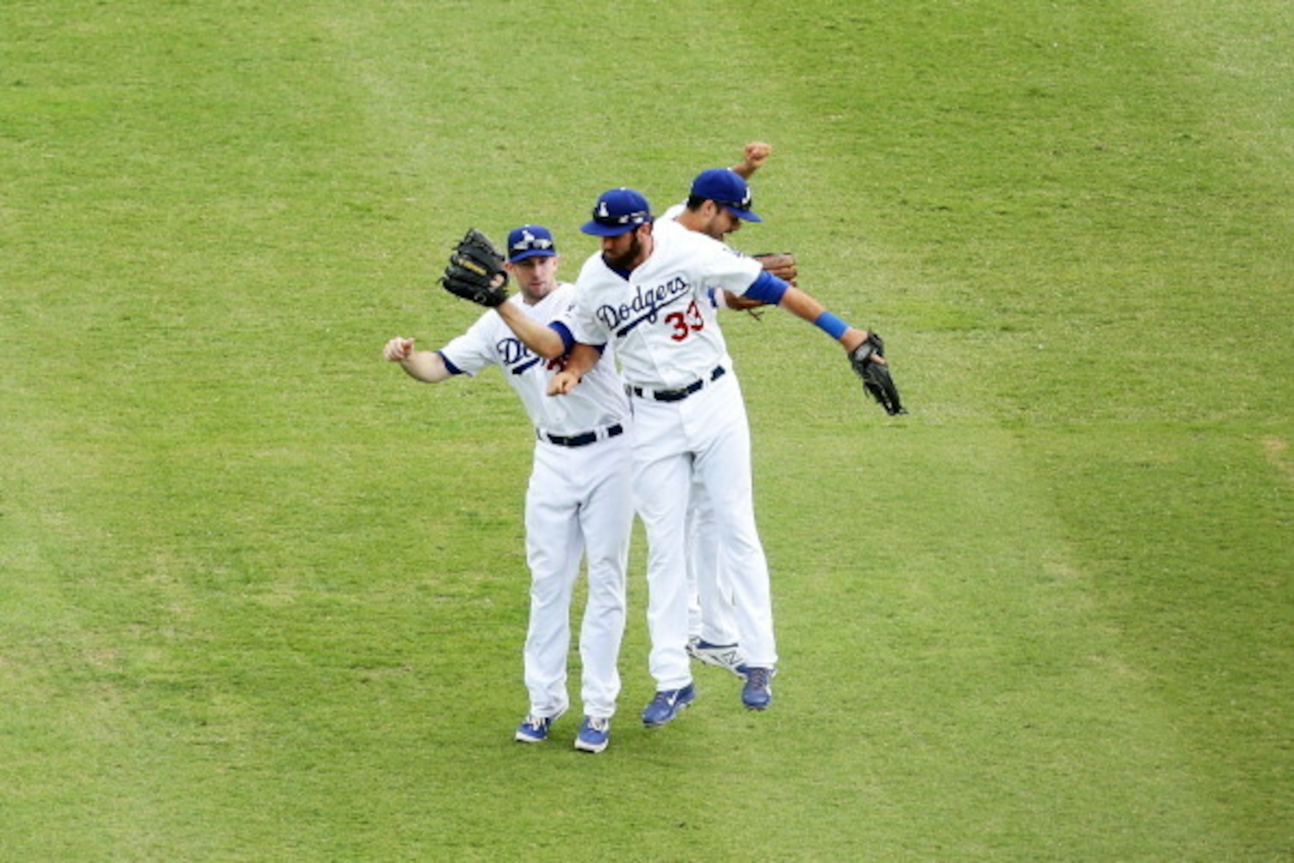 SYDNEY, AUSTRALIA - MARCH 23: (L-R) Mike Baxter, Scott Van Slyk and Andre Ethier of the Dodgers celebrate winning the MLB match between the Los Angeles Dodgers and the Arizona Diamondbacks at Sydney Cricket Ground on March 23, 2014 in Sydney, Australia. SYDNEY, AUSTRALIA - MARCH 23: (L-R) Mike Baxter, Scott Van Slyk and Andre Ethier of the Dodgers celebrate winning the MLB match between the Los Angeles Dodgers and the Arizona Diamondbacks at Sydney Cricket Ground on March 23, 2014 in Sydney, Australia.