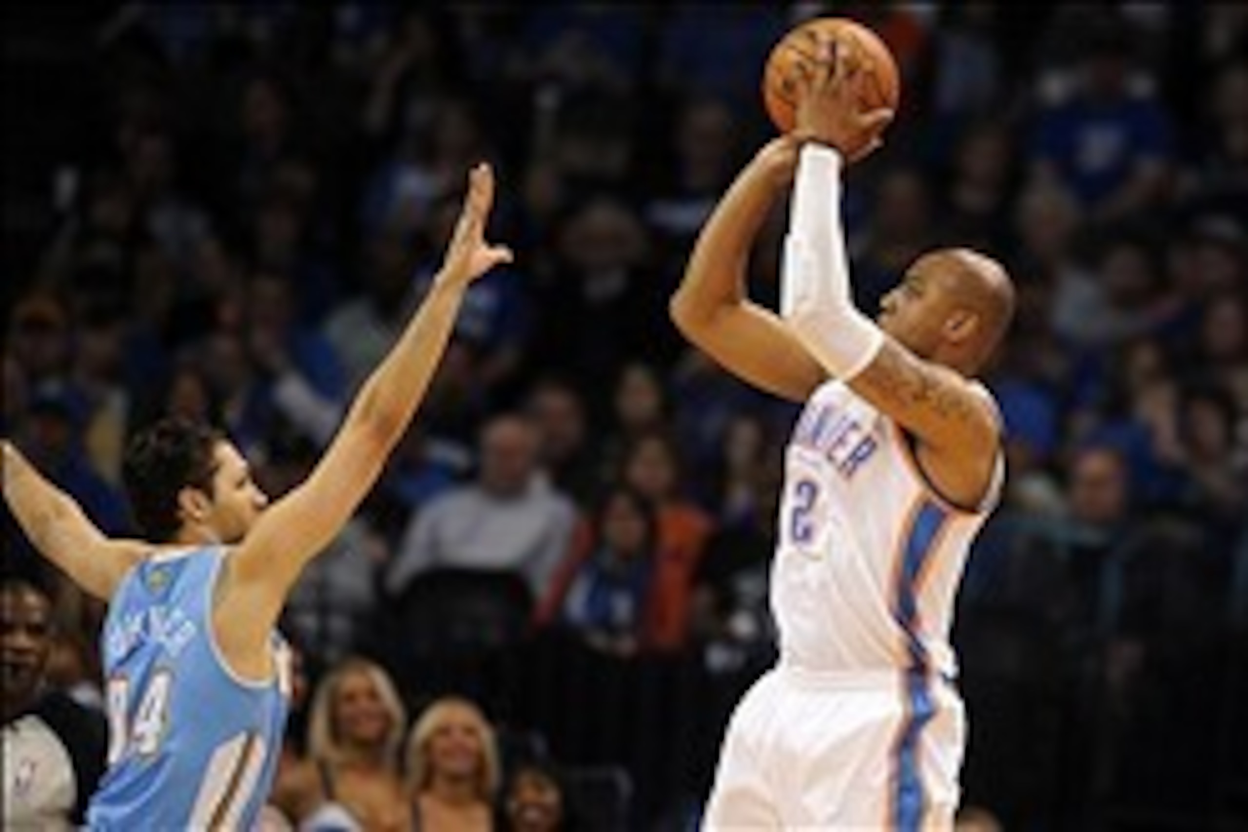 Mar 24, 2014; Oklahoma City, OK, USA;  Oklahoma City Thunder forward Caron Butler (2) attempts a shot against Denver Nuggets guard Evan Fournier (94) during the third quarter at Chesapeake Energy Arena. Mandatory Credit: Mark D. Smith-USA TODAY Sports