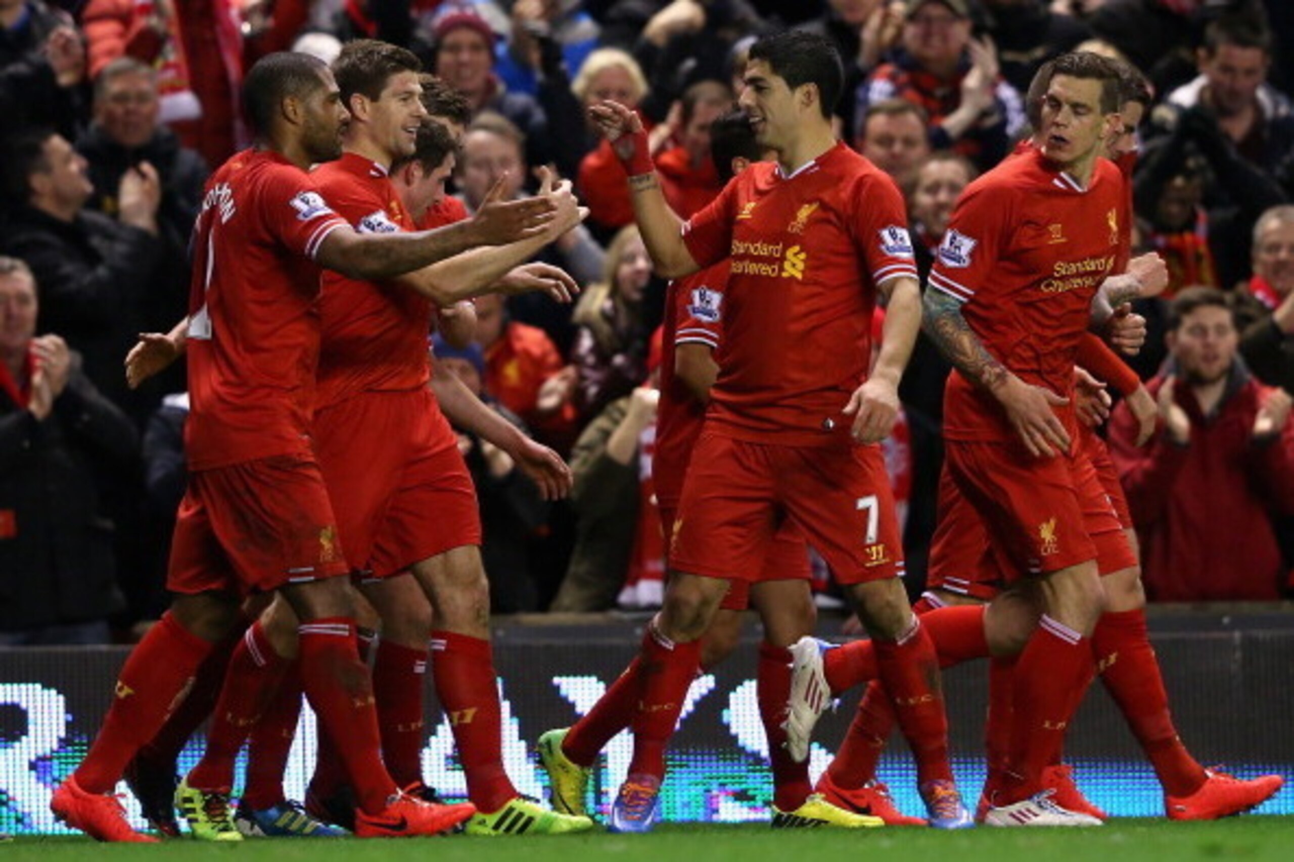 LIVERPOOL, ENGLAND - MARCH 26:  Steven Gerrard of Liverpool celebrates scoring the first goal with his team-mates during the Barclays Premier League match between Liverpool and Sunderland at Anfield on March 26, 2014 in Liverpool, England.  (Photo by Alex