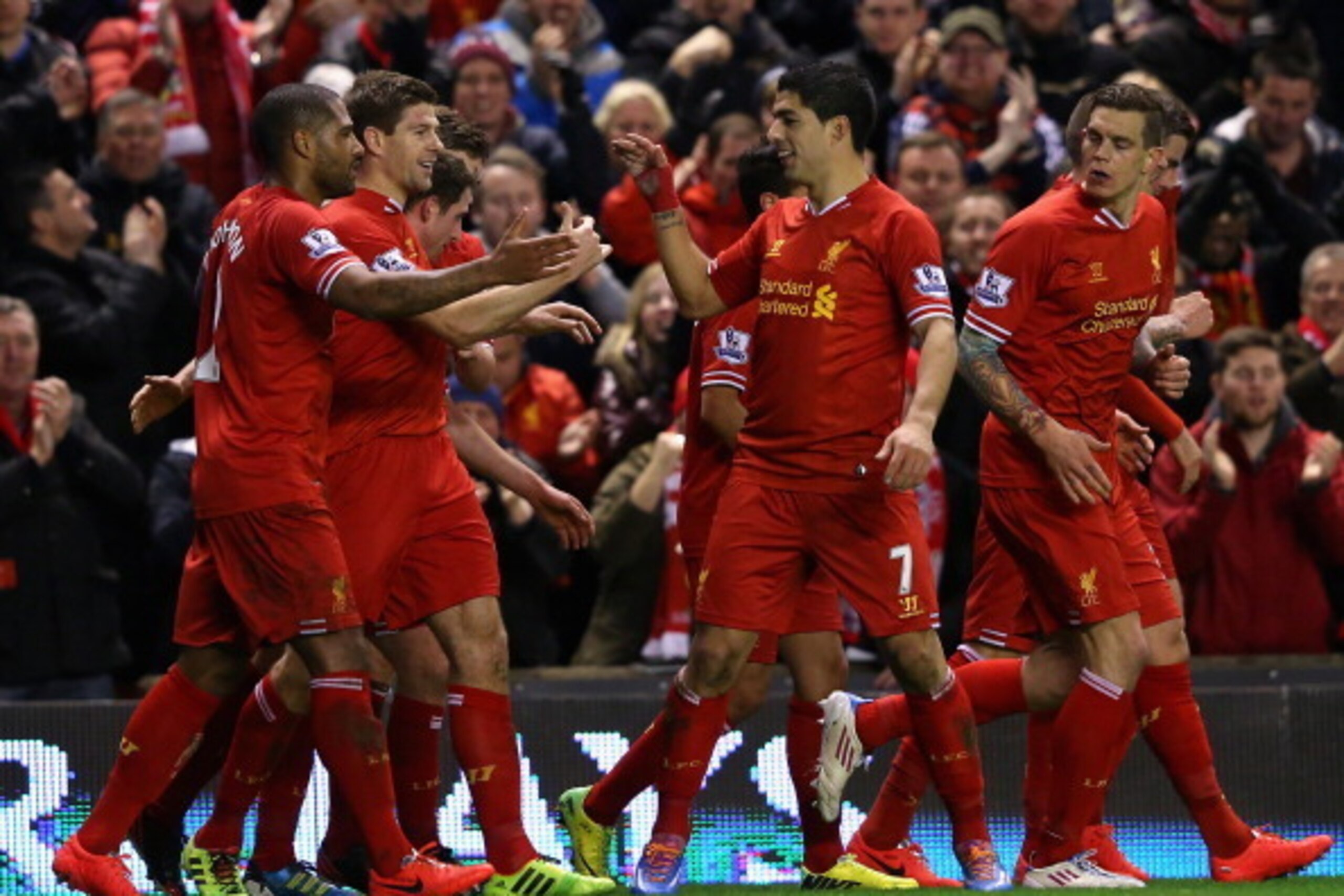 LIVERPOOL, ENGLAND - MARCH 26:  Steven Gerrard of Liverpool celebrates scoring the first goal with his team-mates during the Barclays Premier League match between Liverpool and Sunderland at Anfield on March 26, 2014 in Liverpool, England.  (Photo by Alex