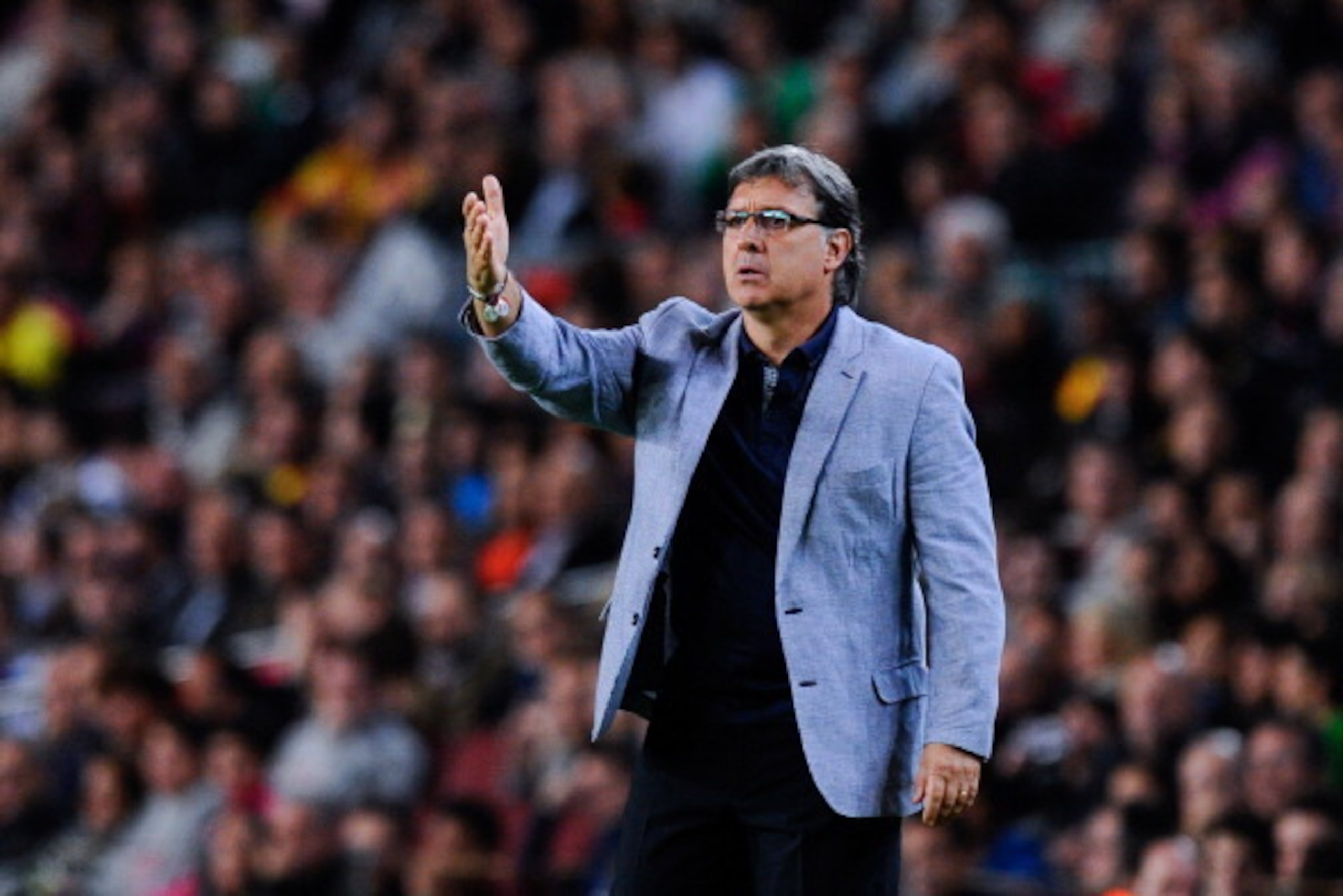 BARCELONA, SPAIN - NOVEMBER 01:  Head coach Gerardo 'Tata' Martino of FC Barcelona gives instructions during the La Liga match between FC Barcelona and RCD Espanyol at Camp Nou on November 1, 2013 in Barcelona, Spain.  (Photo by David Ramos/Getty Images)