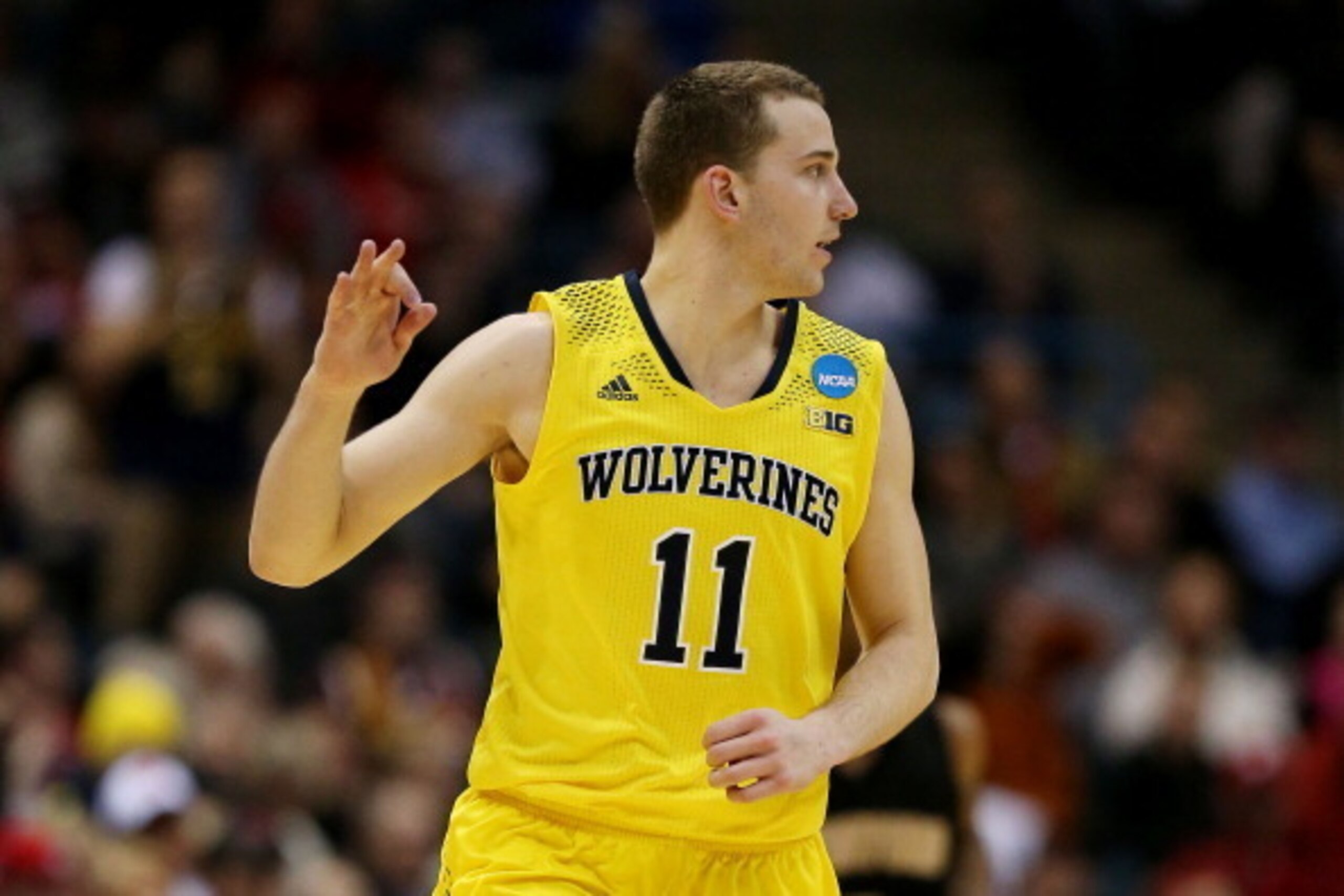 MILWAUKEE, WI - MARCH 20:  Nik Stauskas #11 of the Michigan Wolverines celebrates a three point shot in the second half during the second round of the 2014 NCAA Men's Basketball Tournament at BMO Harris Bradley Center on March 20, 2014 in Milwaukee, Wisco
