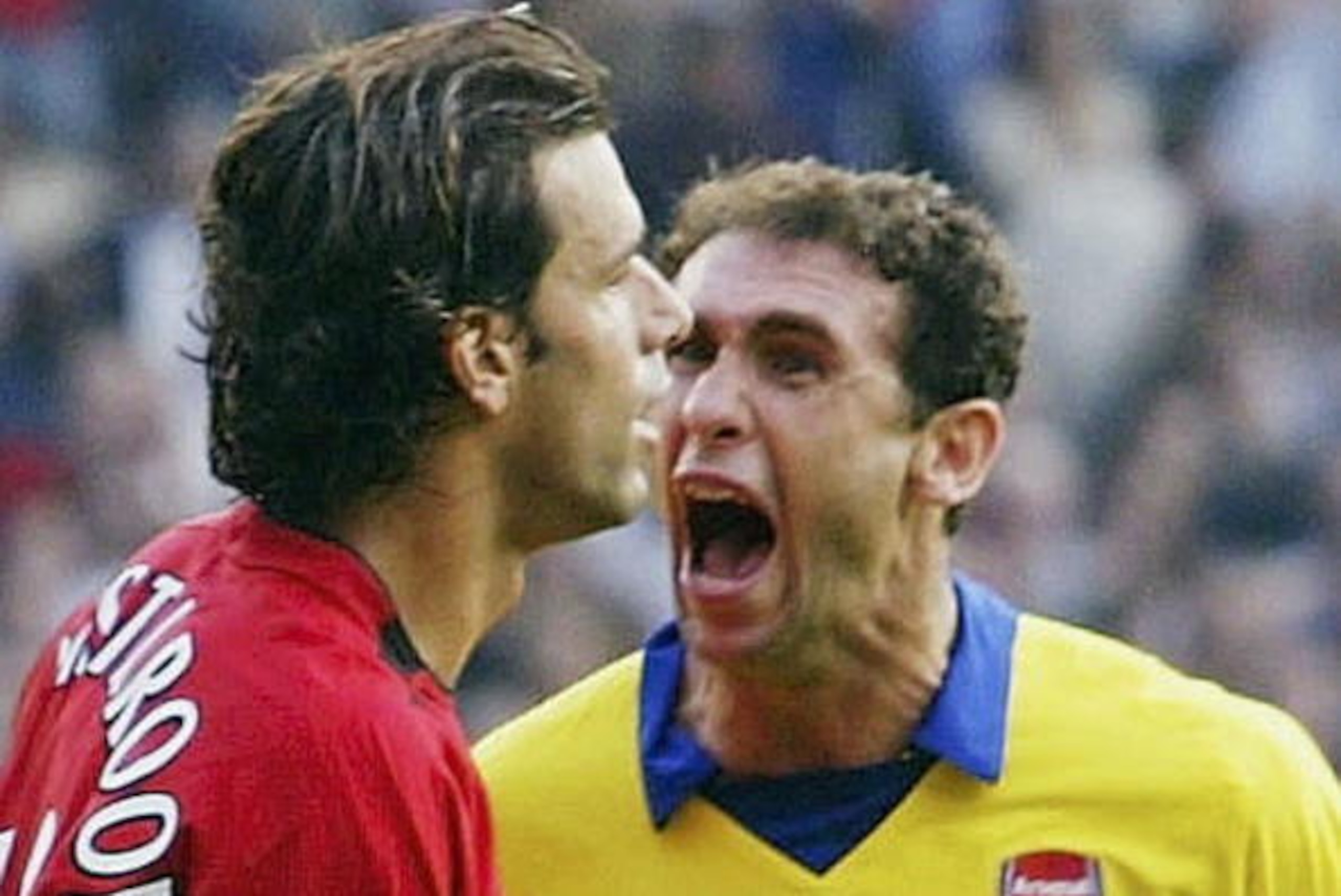 MANCHESTER, ENGLAND - SEPTEMBER 21:  Martin Keown of Arsenal shows his feelings at Ruud Van Nistelrooy of Man Utd after Van Nistelrooy missed his penalty during the FA Barclaycard Premiership match between Manchester United and Arsenal at Old Trafford on 