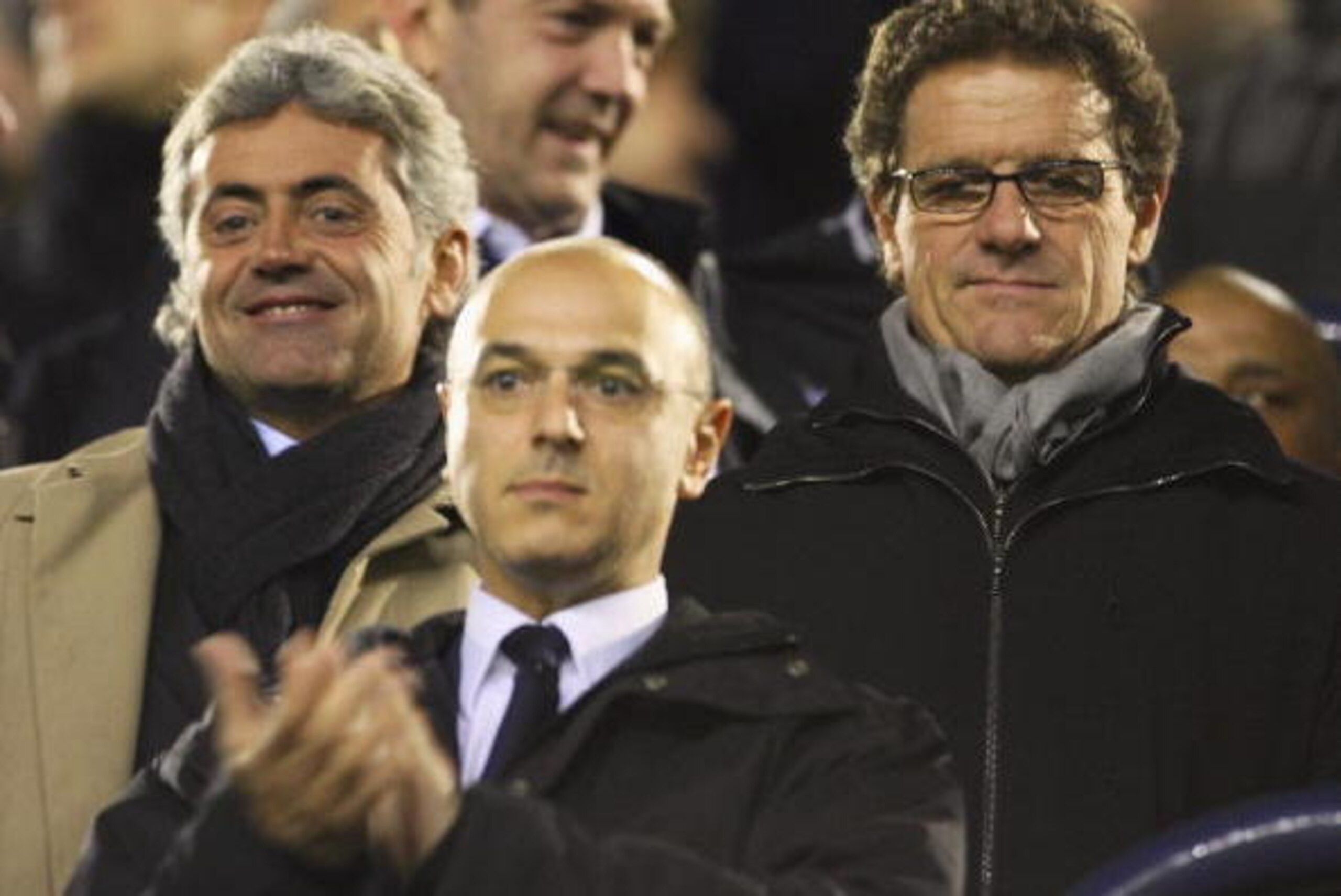 LONDON - FEBRUARY 21:  England coach, Fabio Capello (R), his assistant Franco Baldini (L) and Tottenham chairman, Daniel Levy (C) look on during the UEFA Cup Group G. 2nd leg match between Tottenham Hotspur and Slavia Prague at White Hart Lane on February