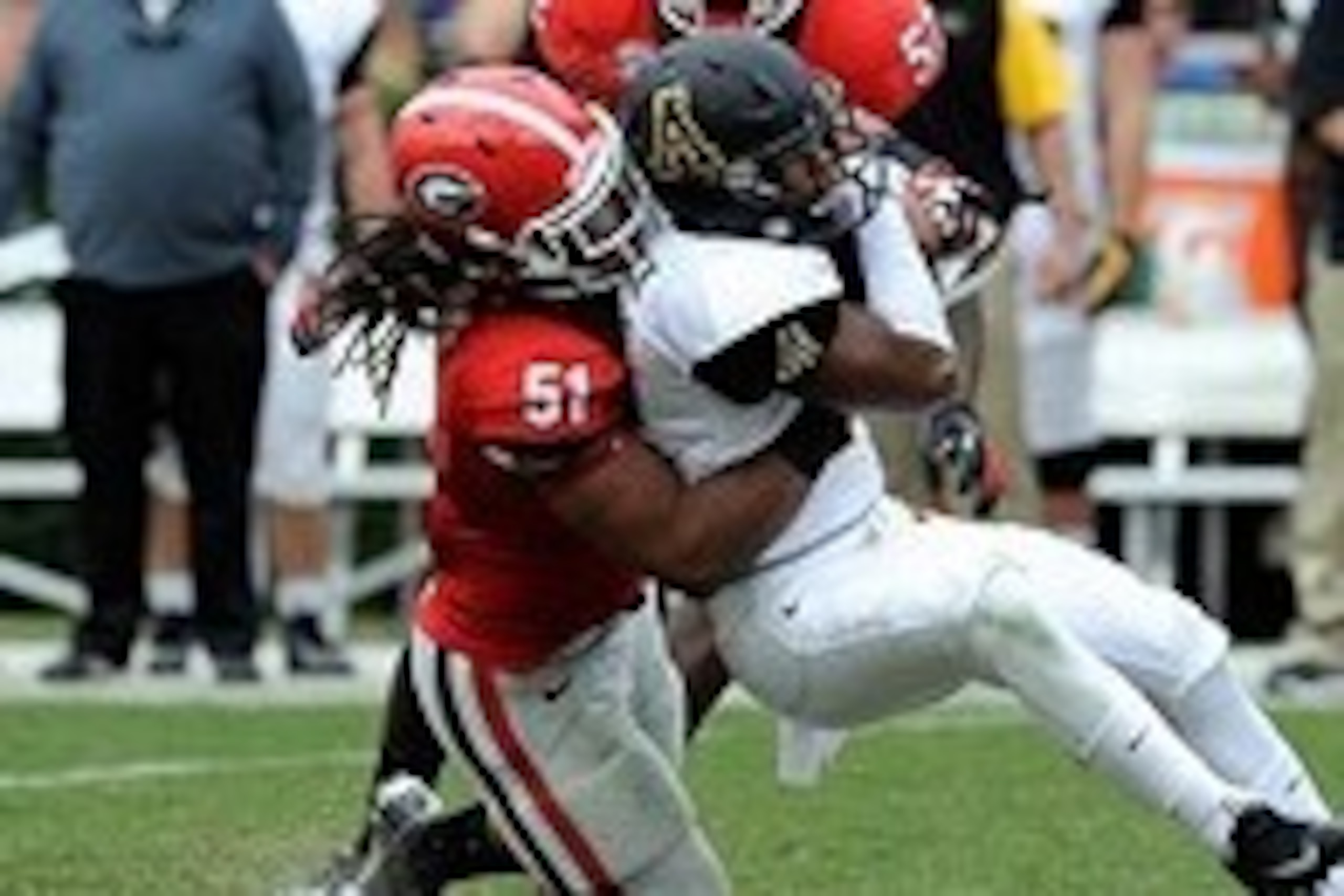 Nov 9, 2013; Athens, GA, USA; Georgia Bulldogs linebacker Ramik Wilson (51) tackles Appalachian State Mountaineers wide receiver Andrew Peacock (11) during the second half at Sanford Stadium. Georgia defeated Appalachian State 45-6. Mandatory Credit: Dale