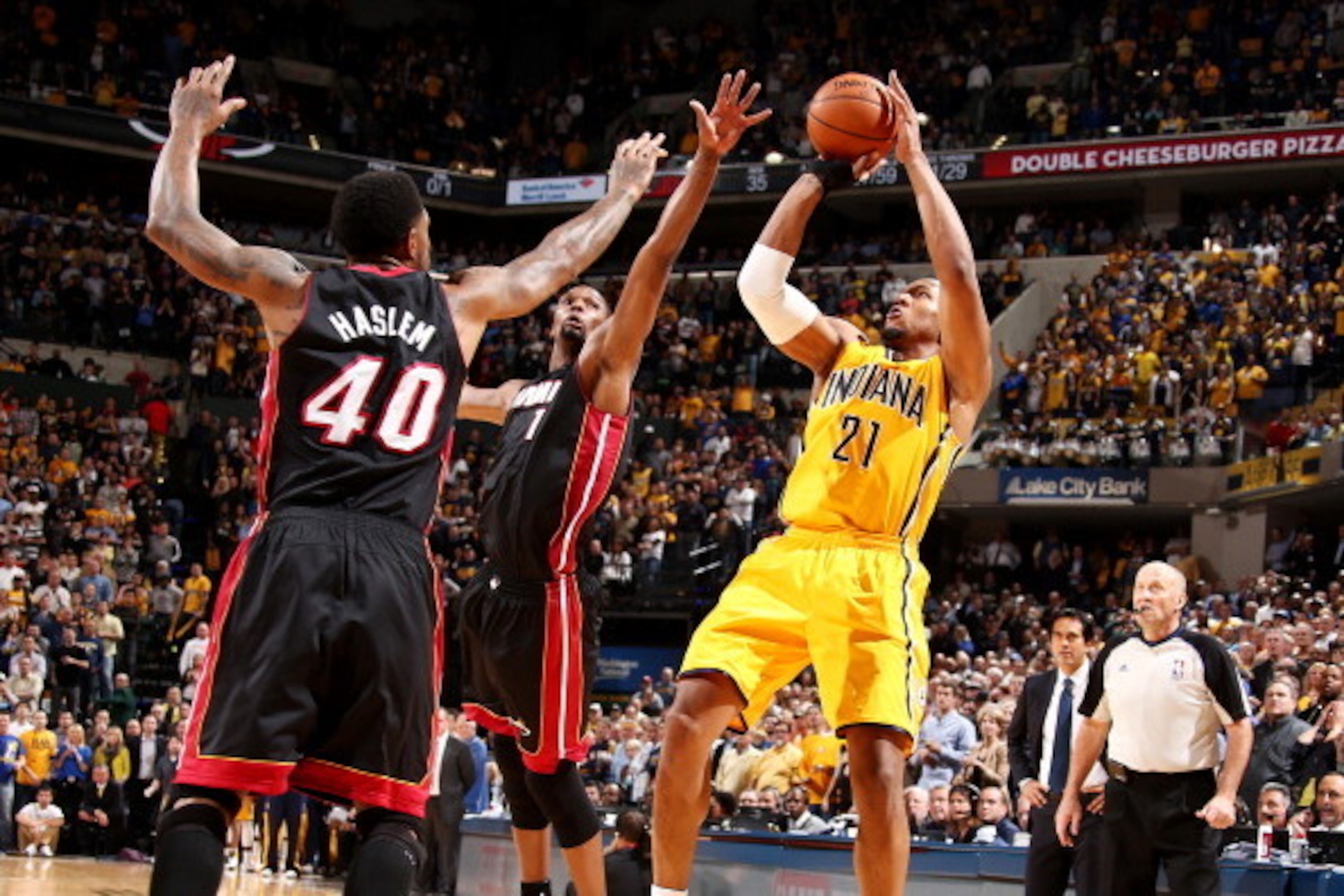 INDIANAPOLIS, IN - MARCH 26: David West #21 of the Indiana Pacers shoots against Chris Bosh #1 of the Miami Heat during a game on March 26, 2014 at Bankers Life Fieldhouse in Indianapolis, IN.  NOTE TO USER: User expressly acknowledges and agrees that, by