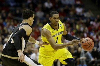 MILWAUKEE, WI - MARCH 20:  Glenn Robinson III #1 of the Michigan Wolverines drives against Lee Skinner #34 of the Wofford Terriers in the second half during the second round of the 2014 NCAA Men's Basketball Tournament at BMO Harris Bradley Center on Marc