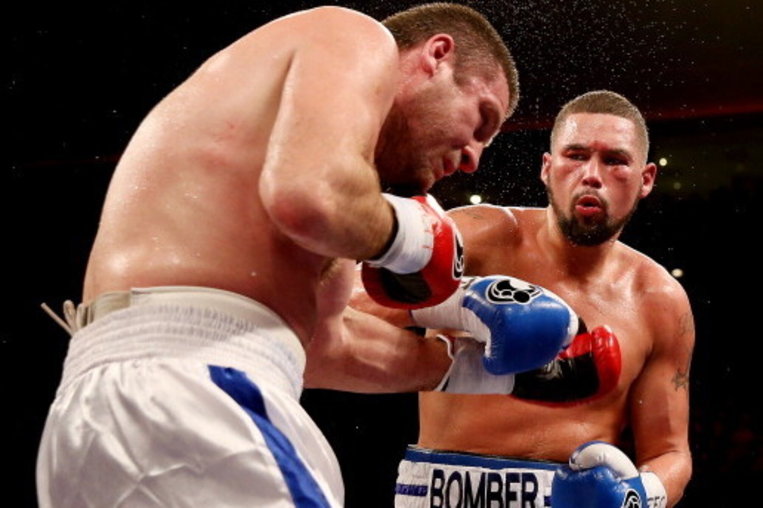 LIVERPOOL, ENGLAND - MARCH 15:  Tony Bellew of Great Britain (R) in action with Valery Brudov of Russia during their Vacant WBO International Cruiserweight bout at Liverpool Echo Arena on March 15, 2014 in Liverpool, England.  (Photo by Scott Heavey/Getty