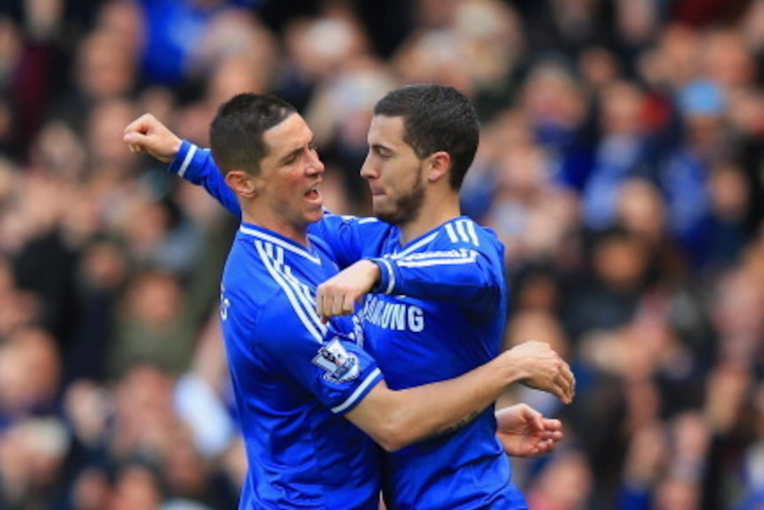 LONDON, ENGLAND - MARCH 22:  Eden Hazard of Chelsea celebrates scoring their third goal from penalty spot with Fernando Torres of Chelsea during the Barclays Premier League match between Chelsea and Arsenal at Stamford Bridge on March 22, 2014 in London, 